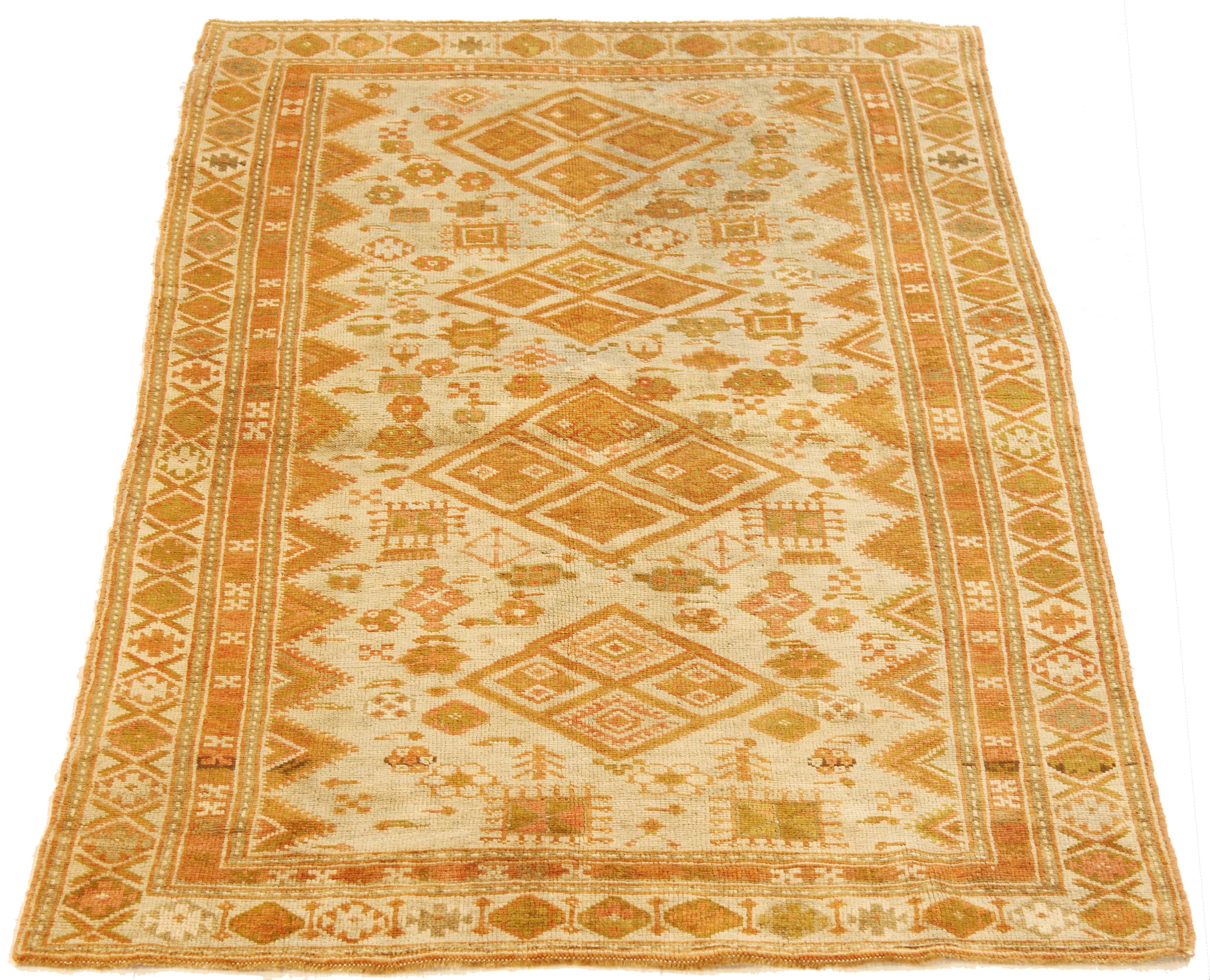Antique Persian rug handwoven from the finest sheep’s wool and colored with all-natural vegetable dyes that are safe for humans and pets. It’s a traditional Bijar design featuring medallions in green and orange over the ivory center field. These