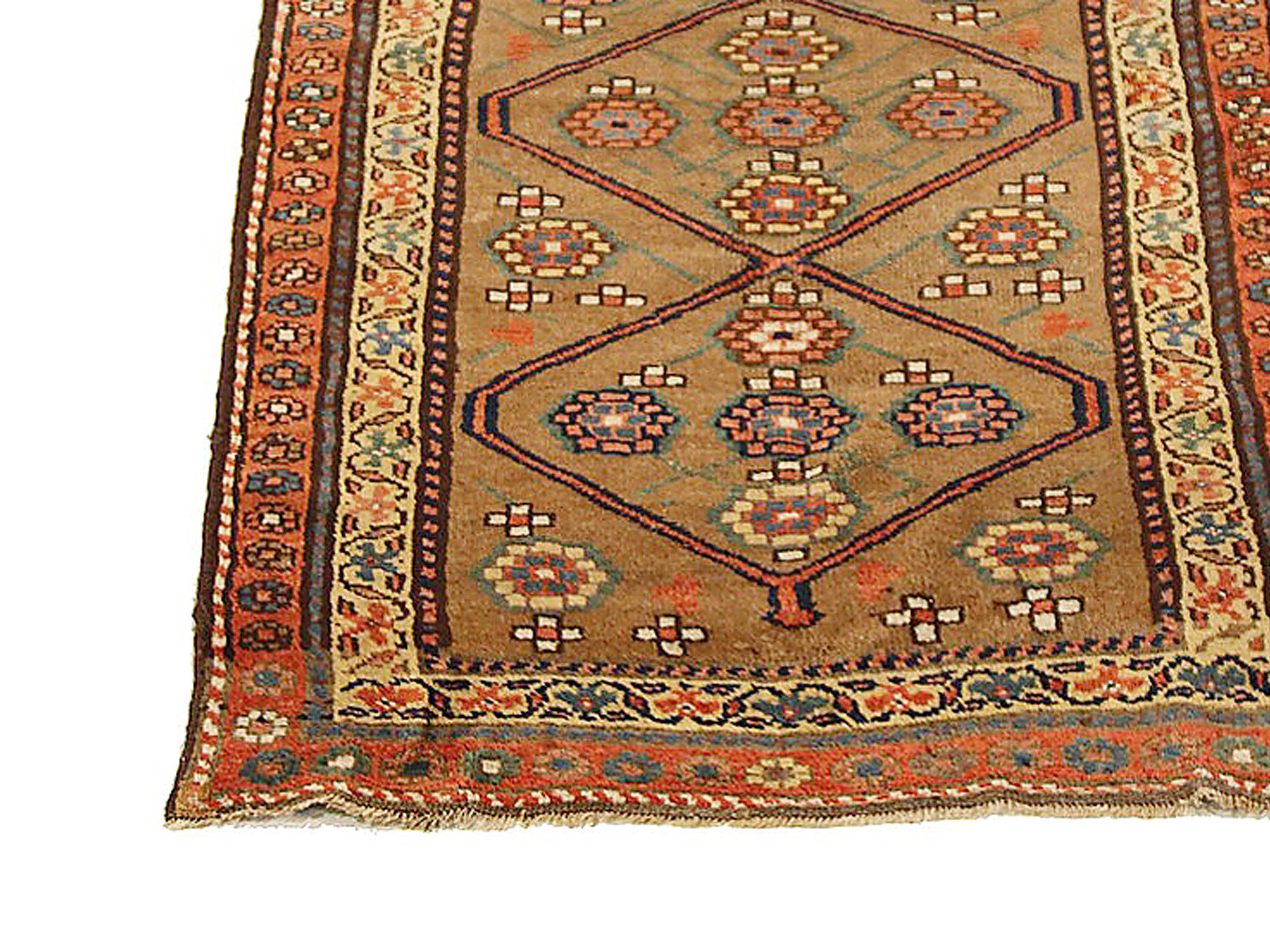 Antique Persian runner rug handwoven from the finest sheep’s wool and colored with all-natural vegetable dyes that are safe for humans and pets. It’s a traditional Bijar design featuring orange and yellow flower medallion details over a beige and