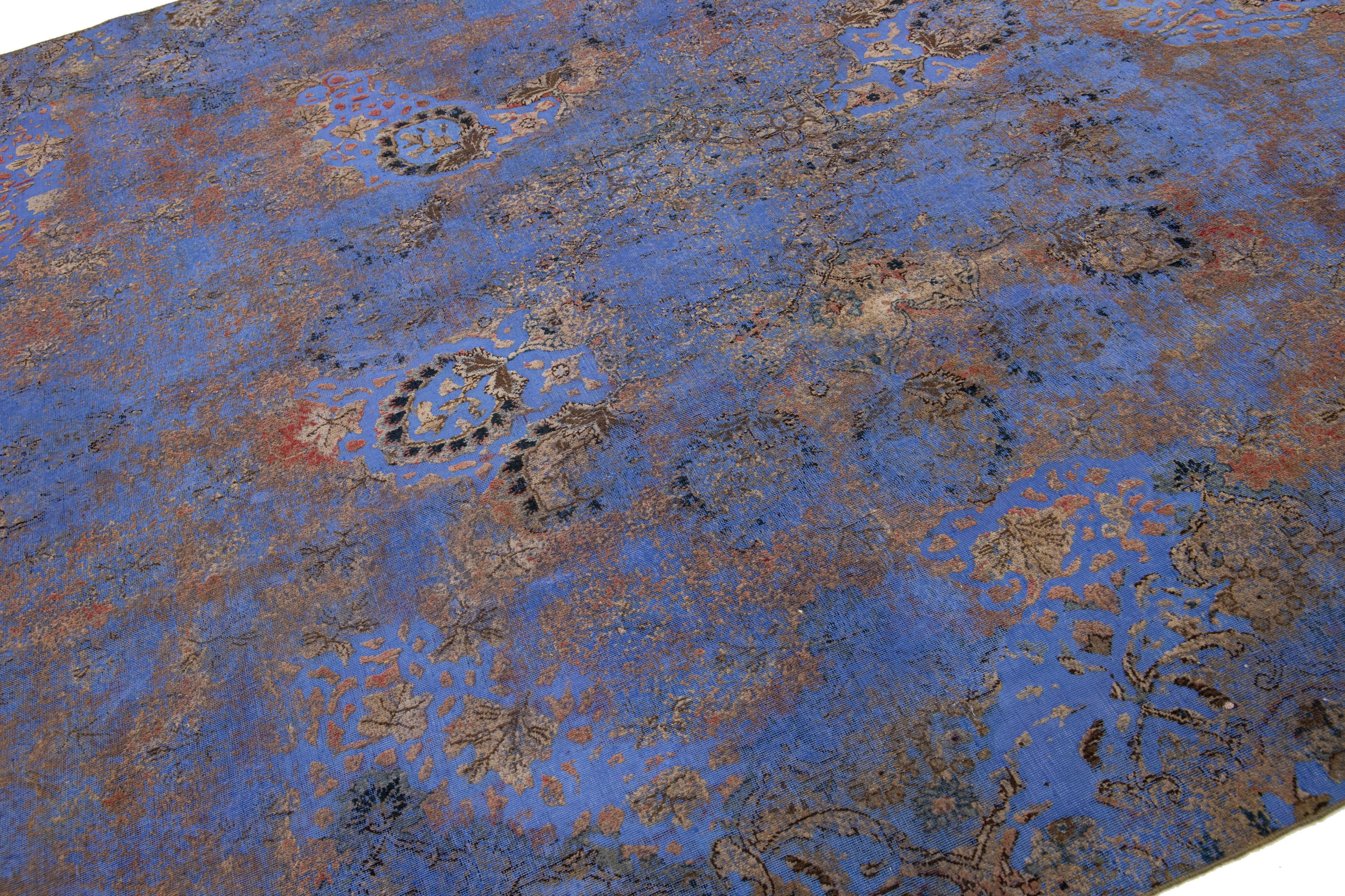 Hand-Knotted Antique Persian Blue Overdyed Wool Rug With Allover Floral Pattern For Sale