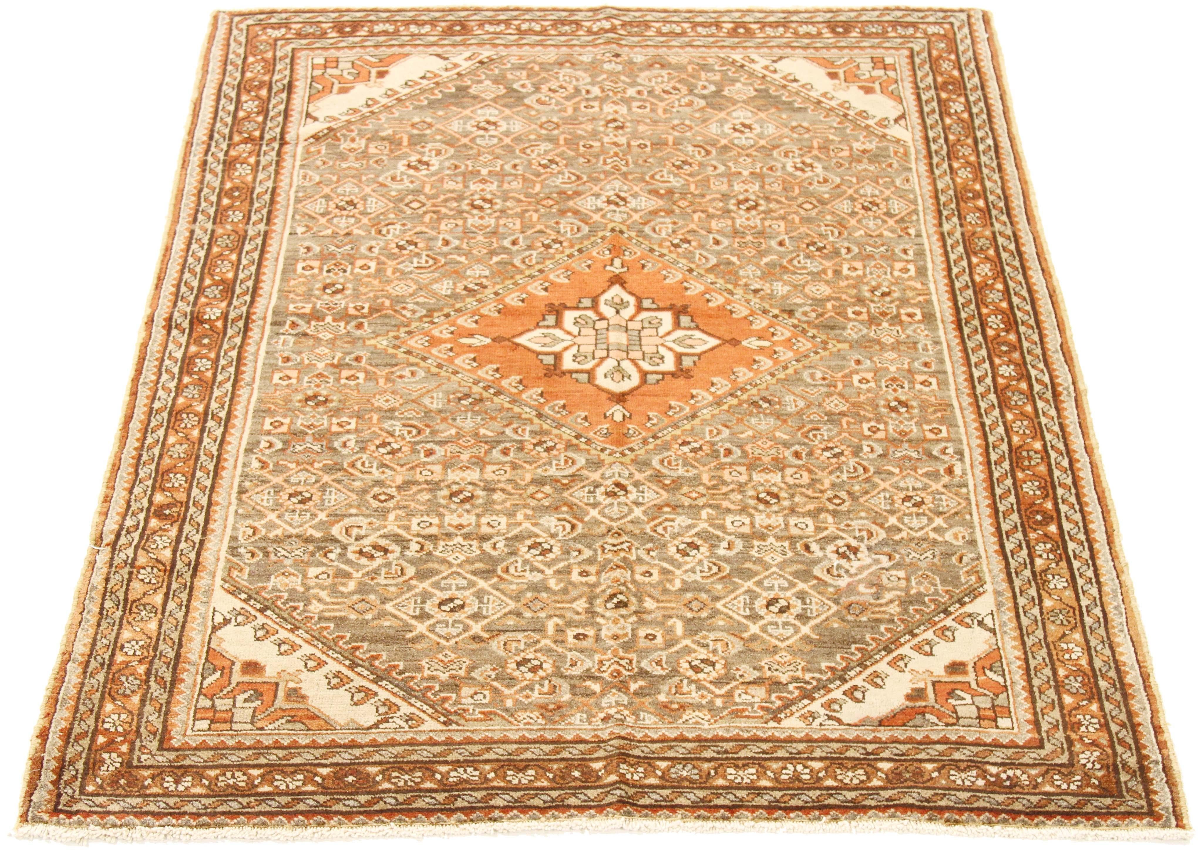Antique Persian rug handwoven from the finest sheep’s wool and colored with all-natural vegetable dyes that are safe for humans and pets. It’s a traditional Borchalo design featuring a gorgeous botanical field highlighted by a brown and white