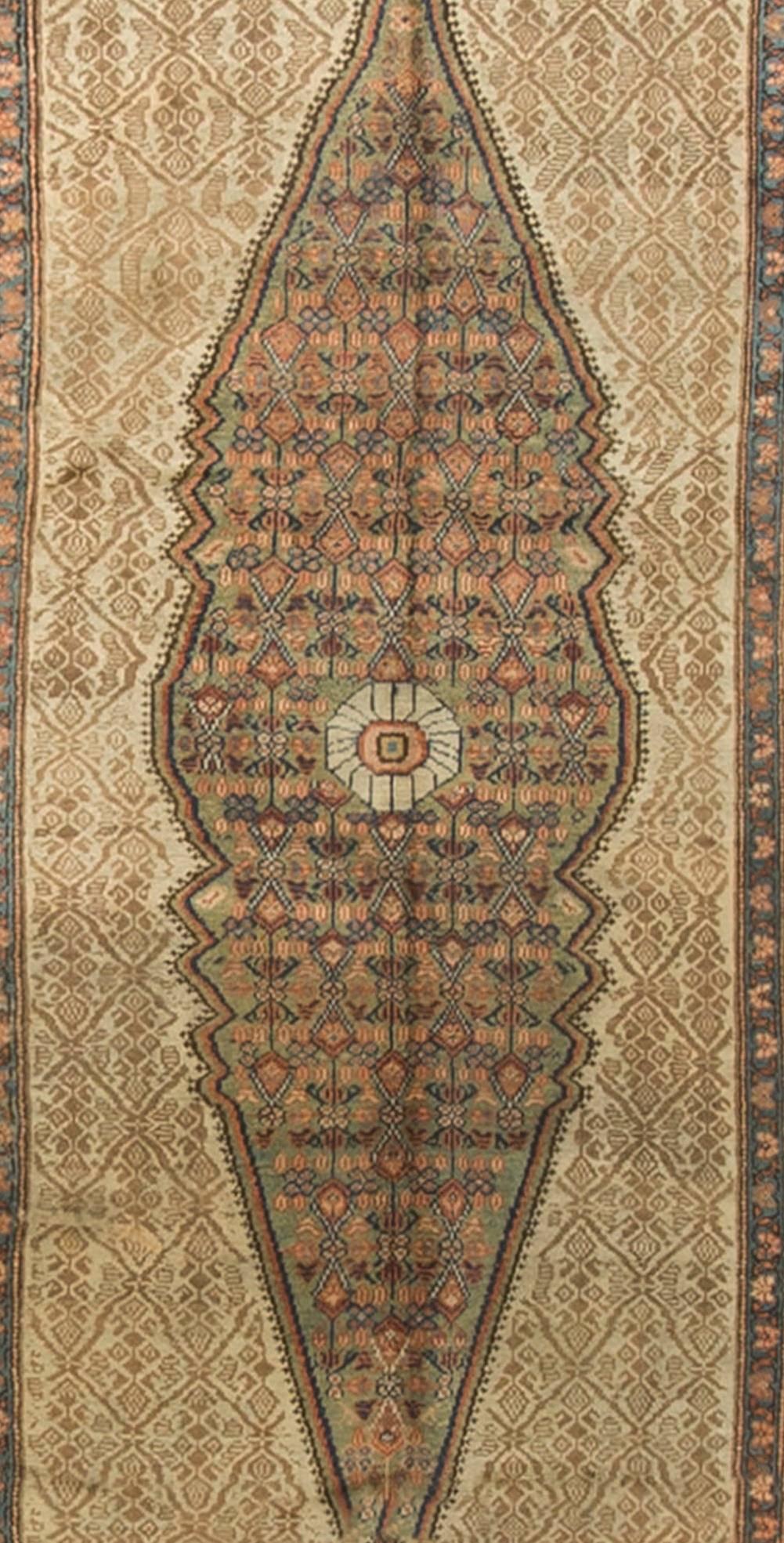 A lovely example of a camel wool handwoven Serab runner. The camel main ground with a central medallion surrounded by a main border in soft blues. The detail in the design has been crafted so skilfully by the weavers to create this wonderful runner.