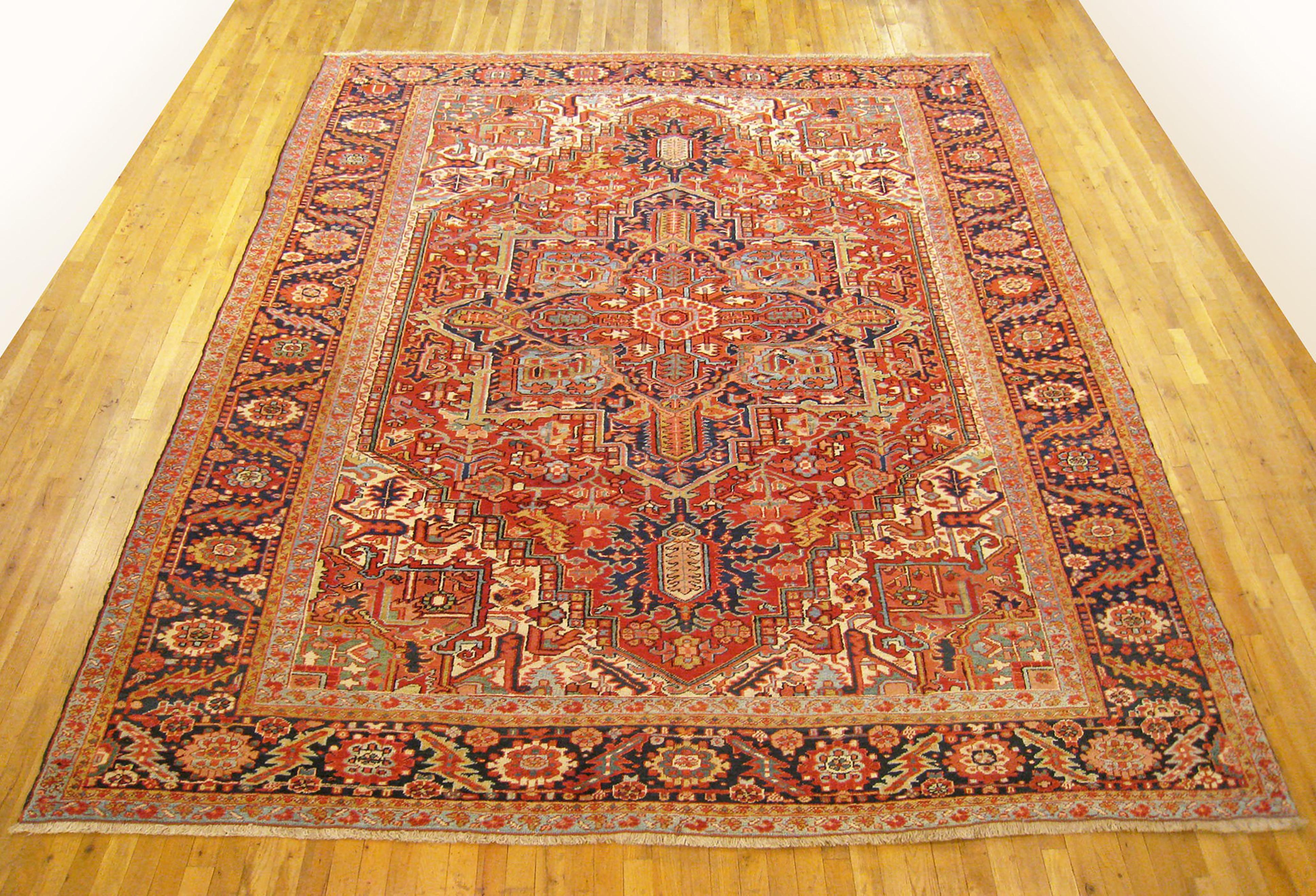 Antique Persian Heriz Oriental rug, Room size

An antique Persian Heriz oriental rug, size 12'5