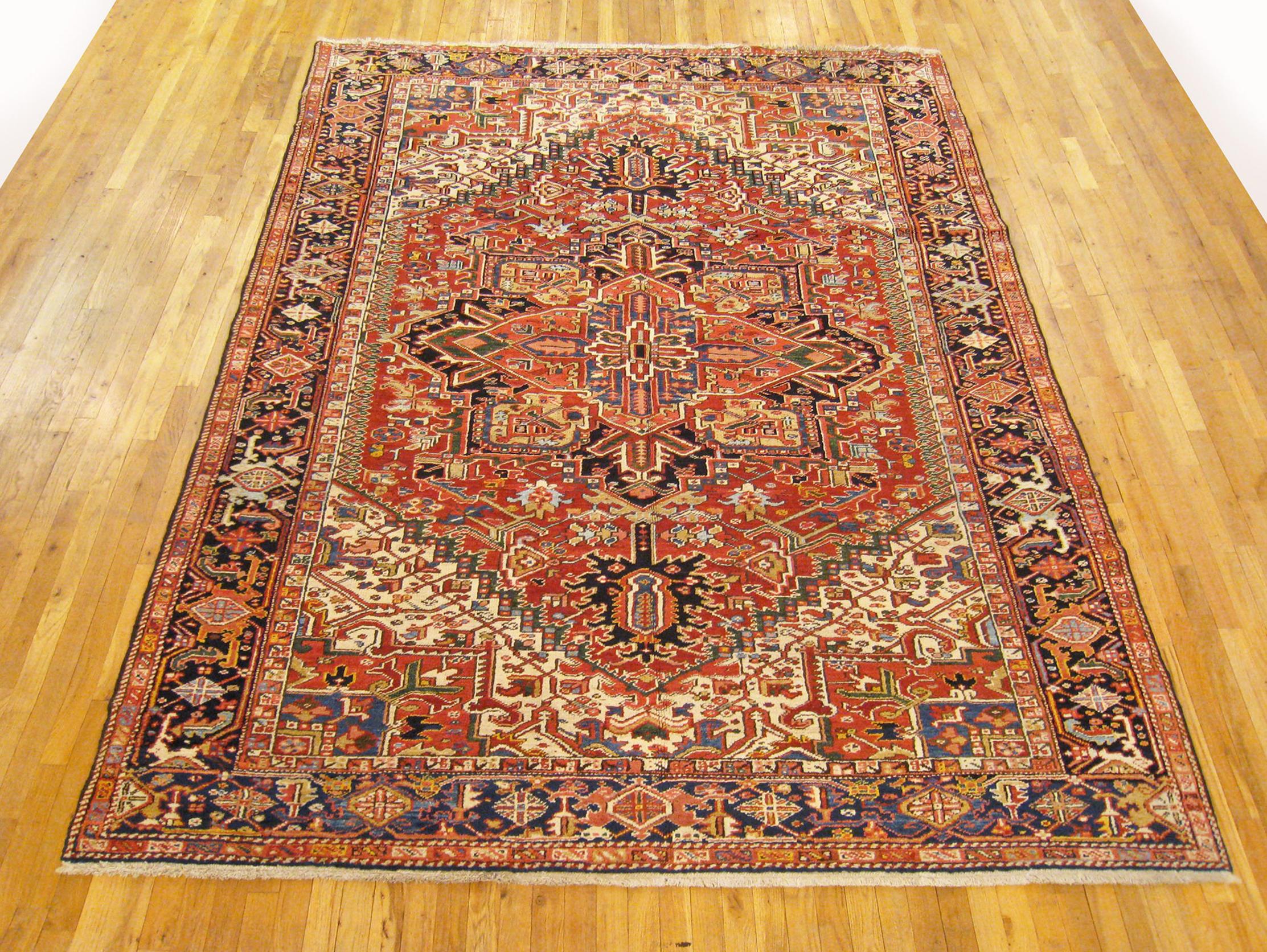 Vintage Persian Heriz Oriental rug, room size

A vintage Persian Heriz oriental rug, size 10'3