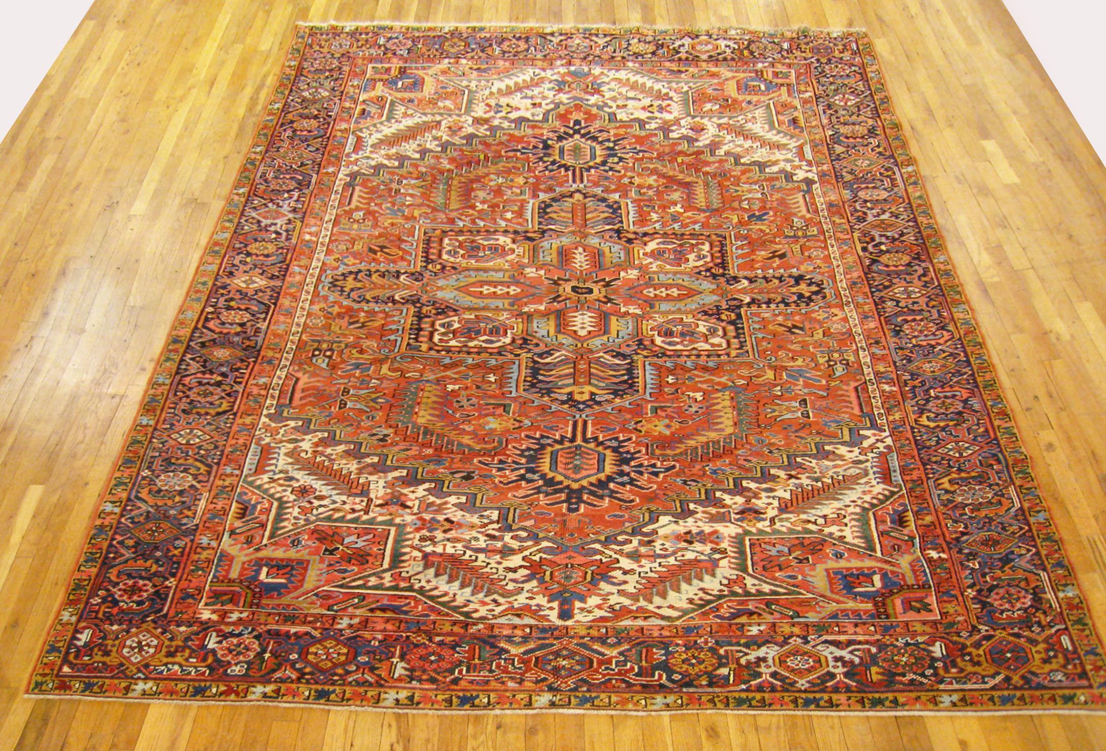 Antique Persian Heriz Oriental rug, room size.

An antique Persian Heriz oriental rug, size 11'5