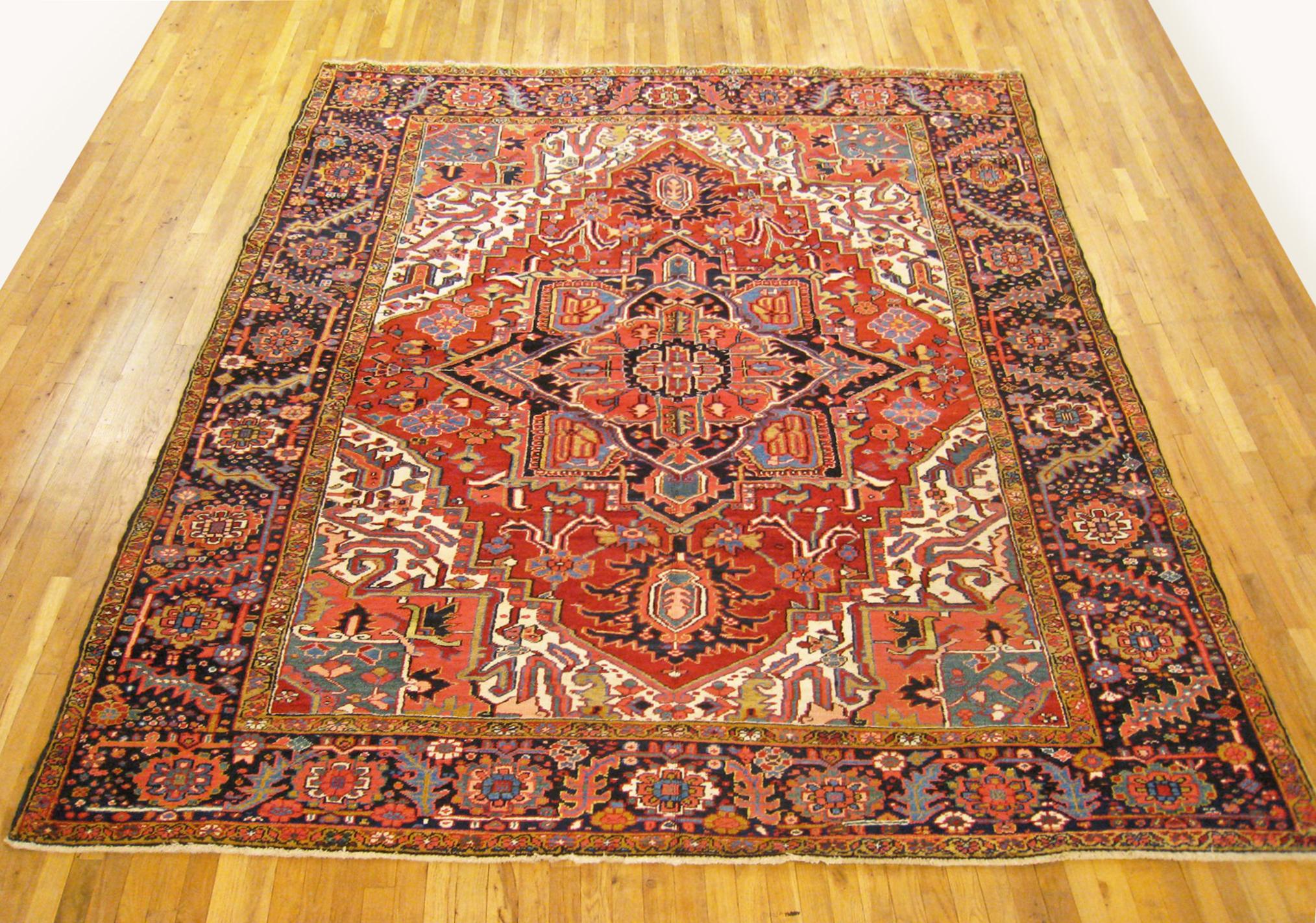 Antique Persian Heriz oriental rug, room size.

An antique Persian Heriz oriental rug, size 10'8