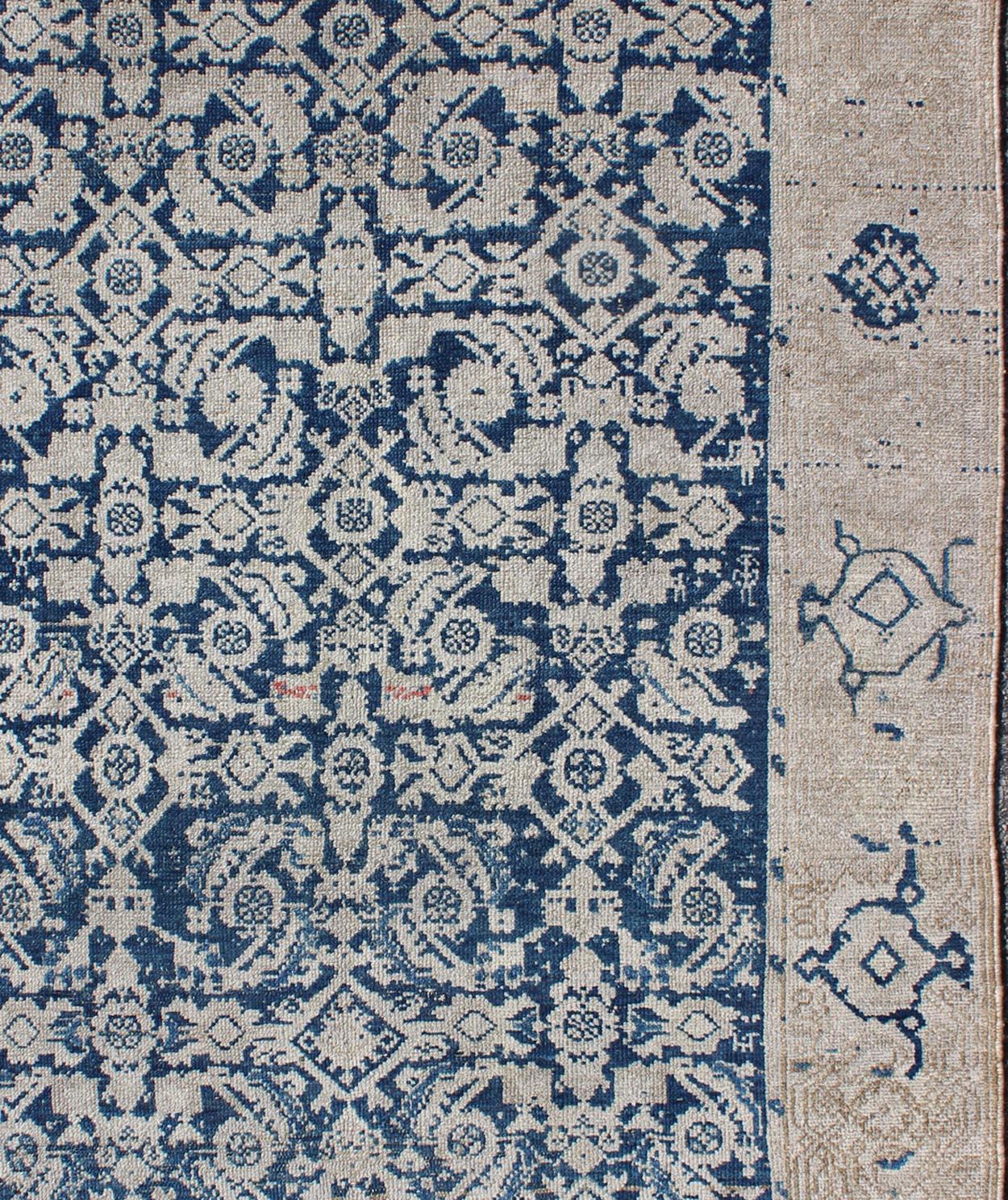 All-over blue geometric Herati design Persian antique Malayer distressed rug in navy blue and earthy tones. Antique Persian rug in navy tones with geometric motifs, rug EN-165849, country of origin / type: Iran / Malayer, circa 1920.

This Persian
