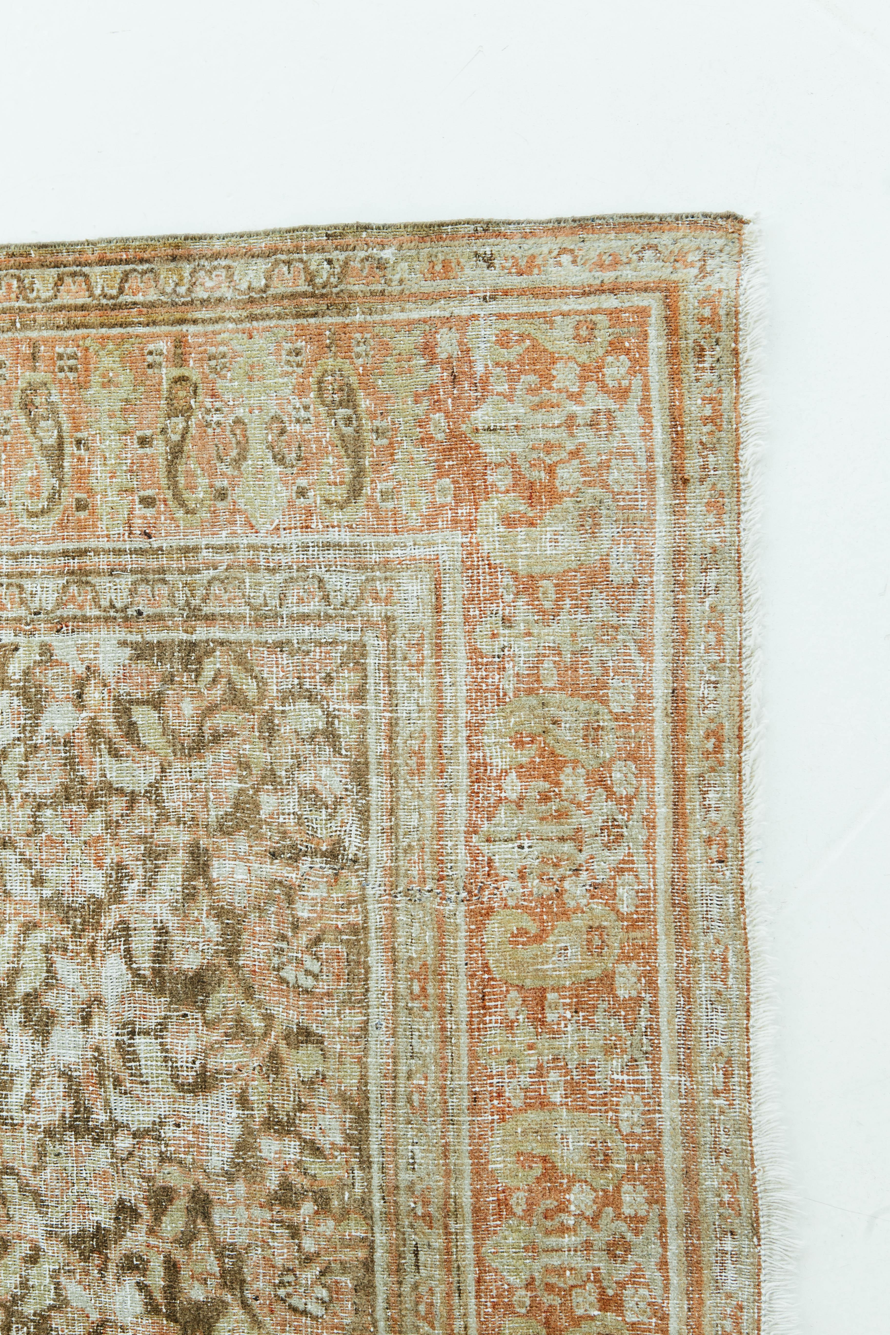 A antique Persian Doroksh finely knotted into a highly decorative piece. Doroksh rugs tend to be subtle in color and are produced in the Doroksh hills in Khorasan Province Iran. This rug's coral, golden tan, and brown colors work cohesively to