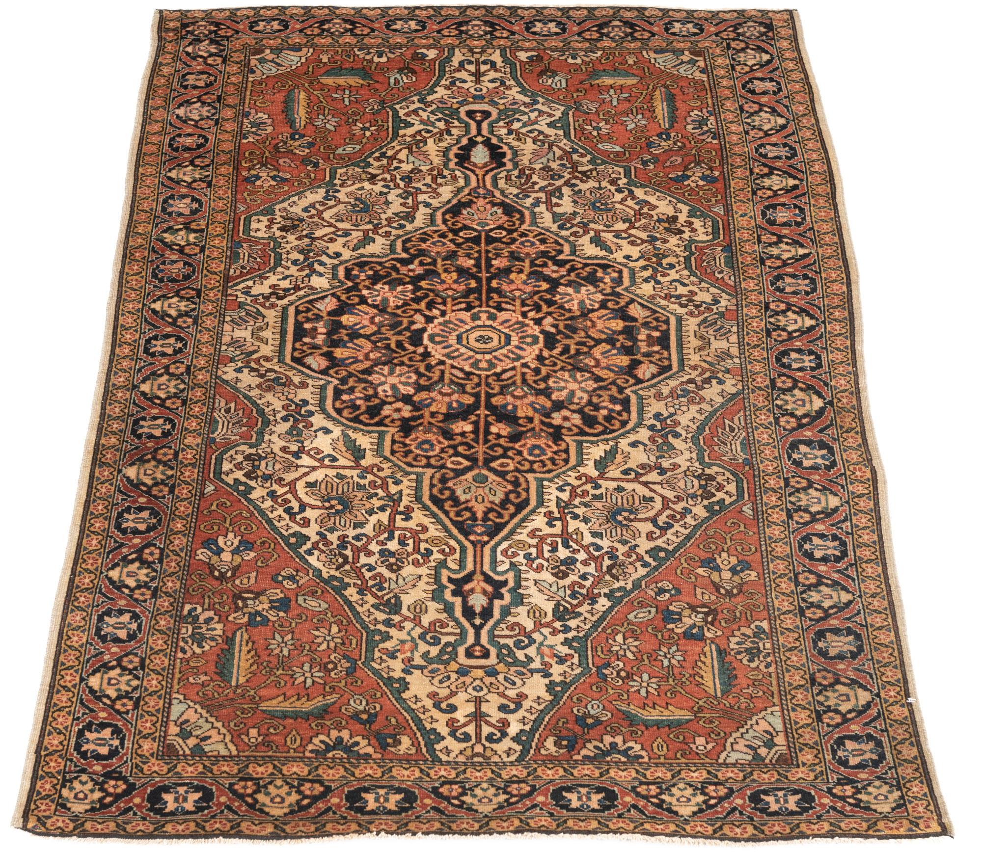 This antique Farahan has a central medallion design with a floral pattern. The finely hand knotted wool and natural dyes are of premier quality from the Farahan region in western Persia. Woven during an exceptional period for rugs of this type in