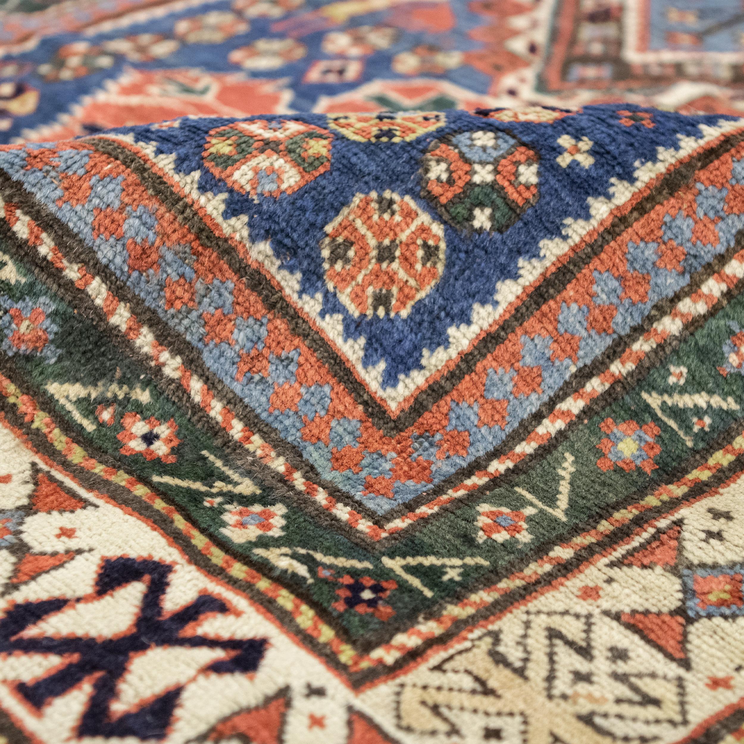 An antique Persian fine Kazak runner is a slender and captivating textile originating from the Kazak region in the Caucasus. Handwoven with premium wool and natural dyes, its bold geometric designs and tribal motifs, like 