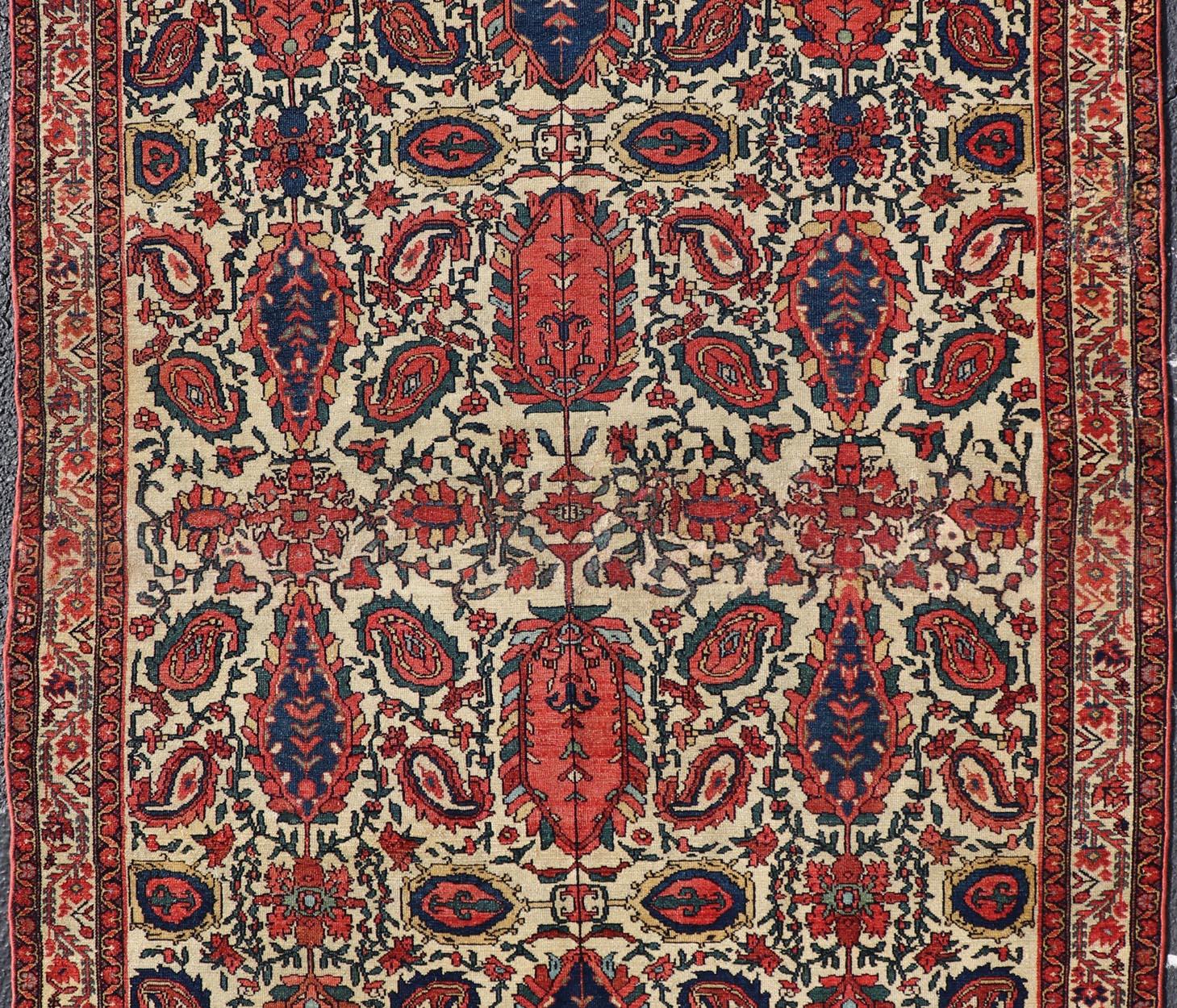 Paisley design antique Persian Malayer rug in ivory, red, blue, brown, rug 18-0407, country of origin / type: Iran / Malayer, circa 1900.

This beautiful antique early 20th century Persian Malayer carpet features an all-over design of repeating