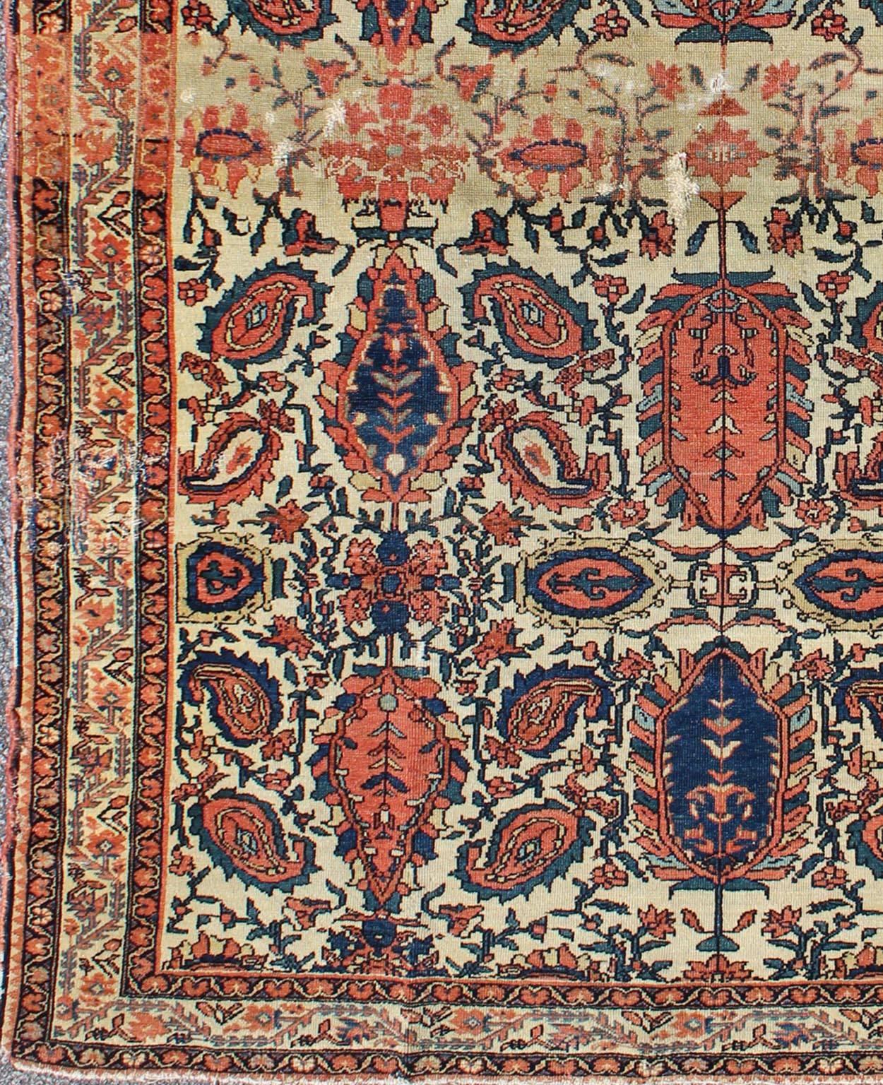 Paisley design antique Persian Malayer rug in ivory, red, blue,  brown, rug 18-0407, country of origin / type: Iran / Malayer, circa 1900.

This beautiful antique early 20th century Persian Malayer carpet features an all-over design of repeating