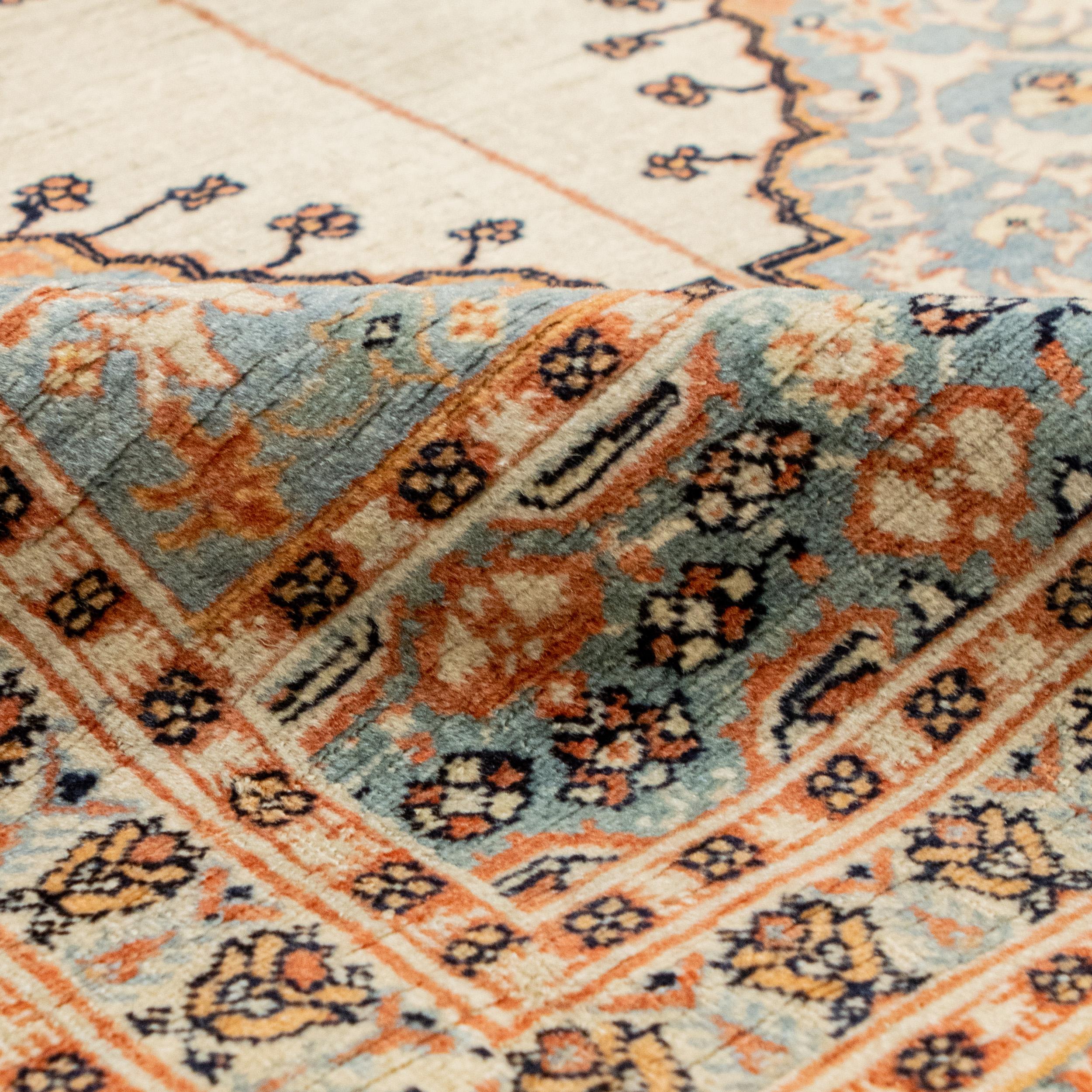 An antique Persian fine Tabriz rug in the size of 3'9