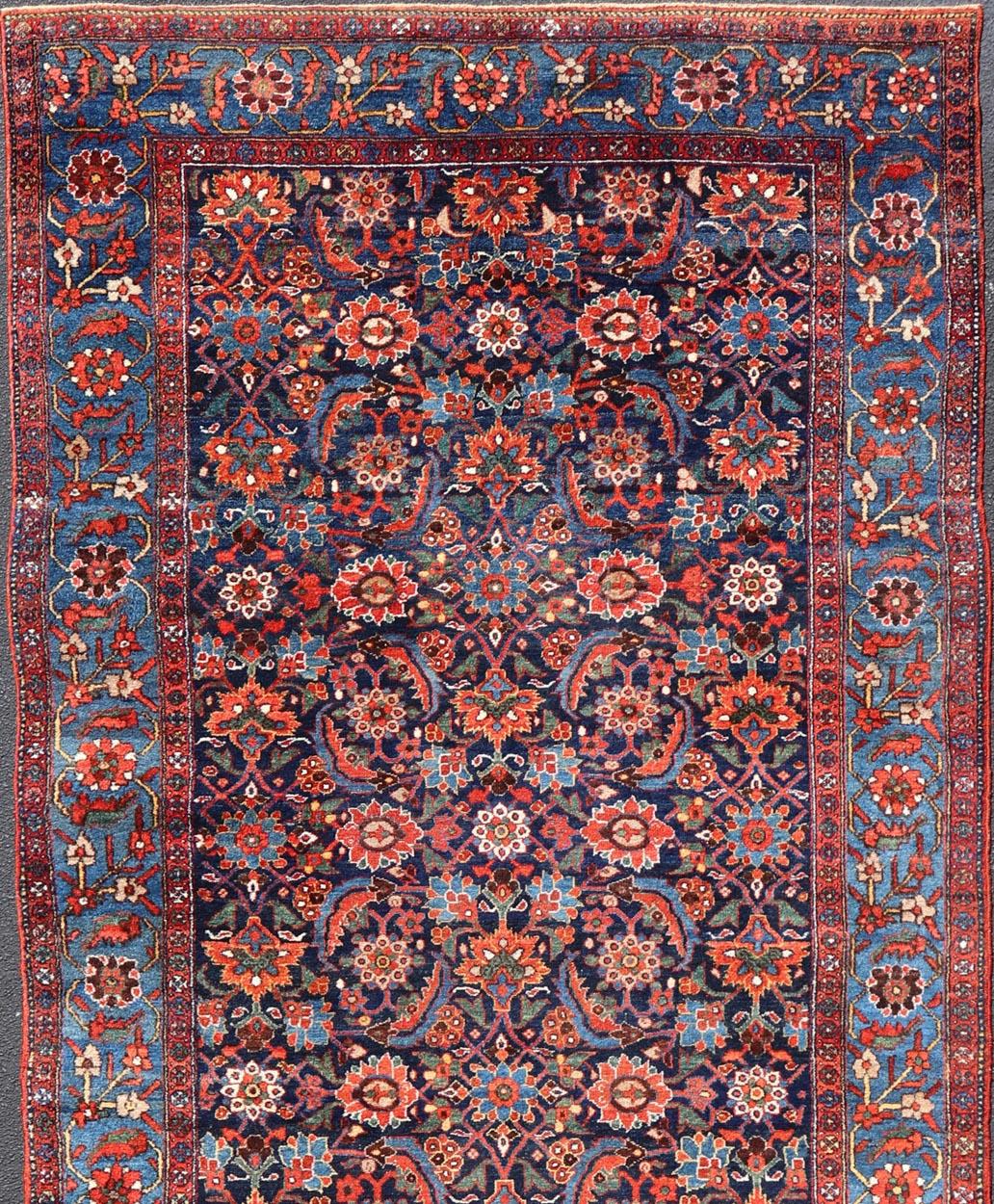 A very fine antique Persian Hamadan gallery runner with all-over design in Blue background, rug V21-0103, country of origin / type: Iran / Hamadan, circa 1920

Measures: 7'4 x 16'8

This antique Persian carpet, from the Hamadan district in