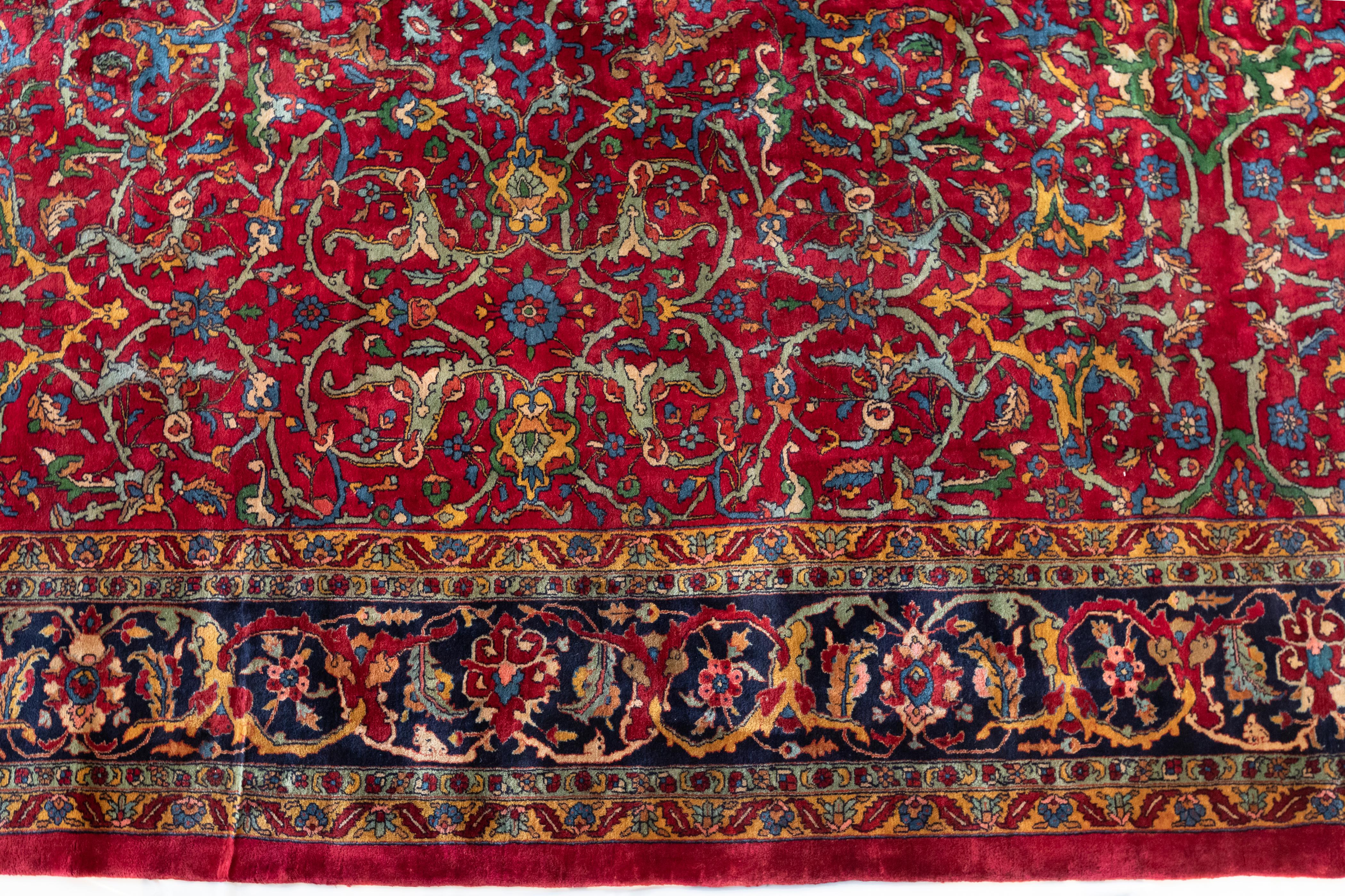 Mohajeran Persian carpets are prized for their clarity of design. They characteristically use allover patterns with a subtle central axis, and consist of a series of finely drawn blossoms, leaf, vinery and sometimes vase forms. Other Mohajerans are