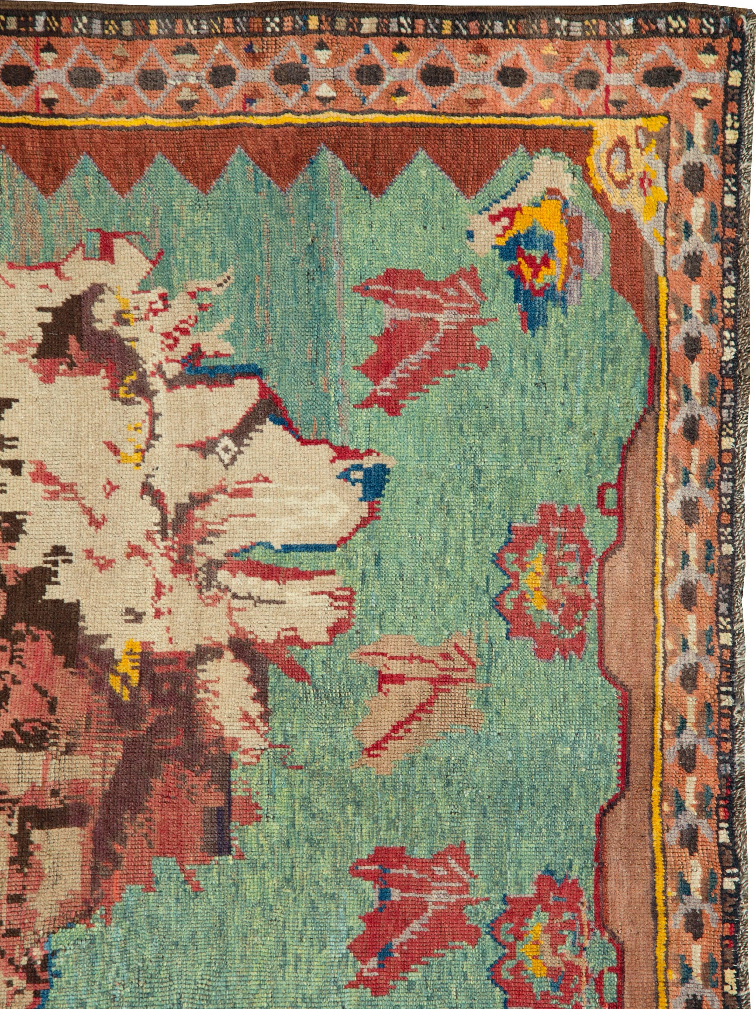 An antique Persian Gabbeh rug from the early 20th century.