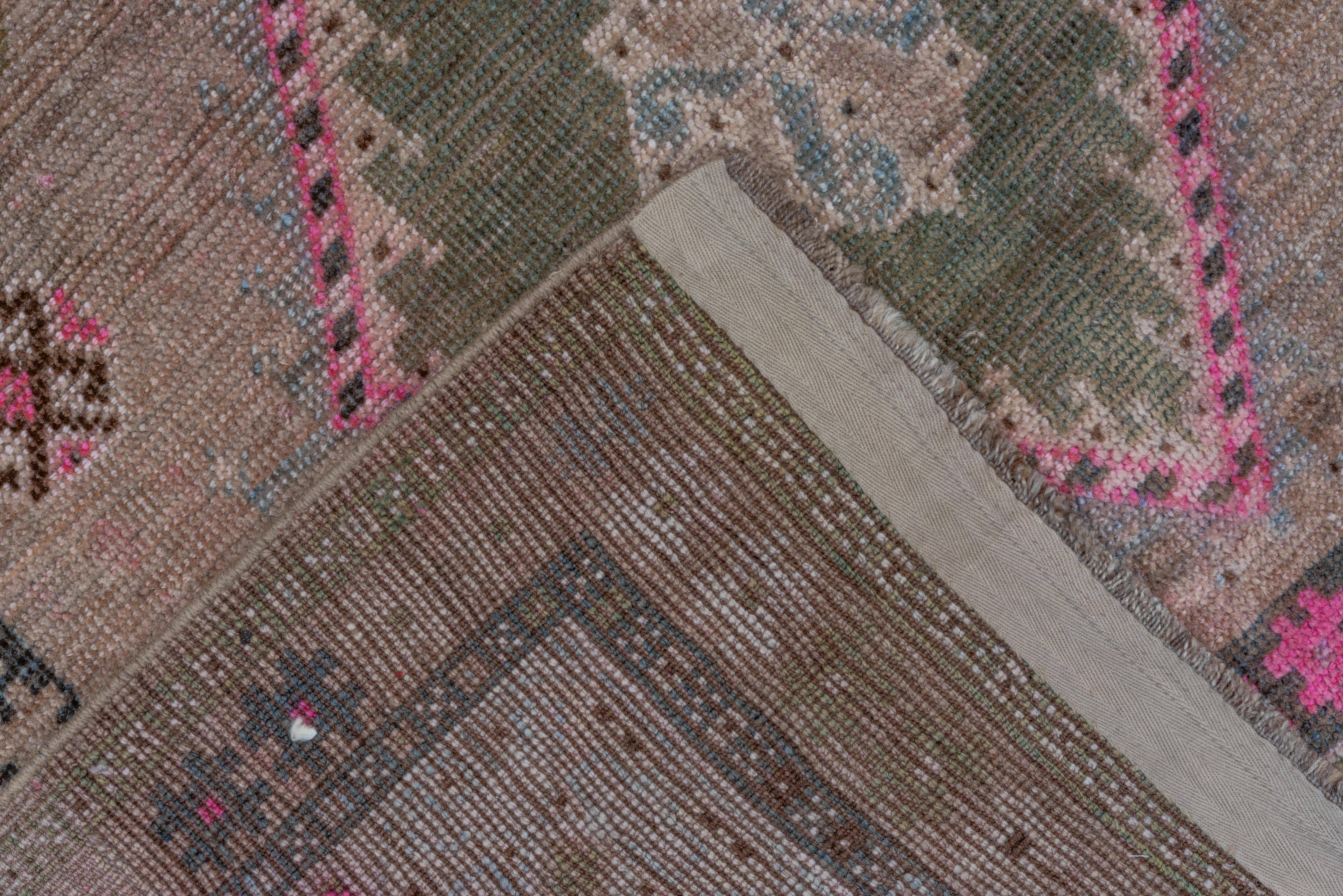 Tribal Antique Persian Gabbeh Rug, Light Brown Field, Pink & Green Accents, circa 1930s For Sale
