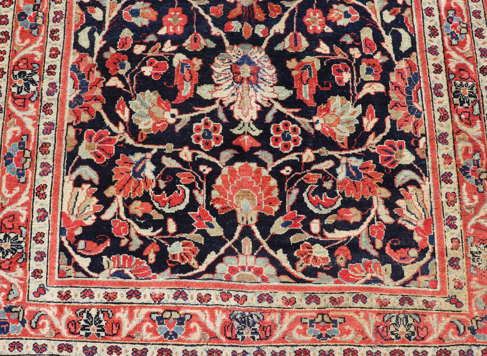 Wool Antique Persian Gallery Runner with Floral Design in D. Blue & Jewel Tones For Sale