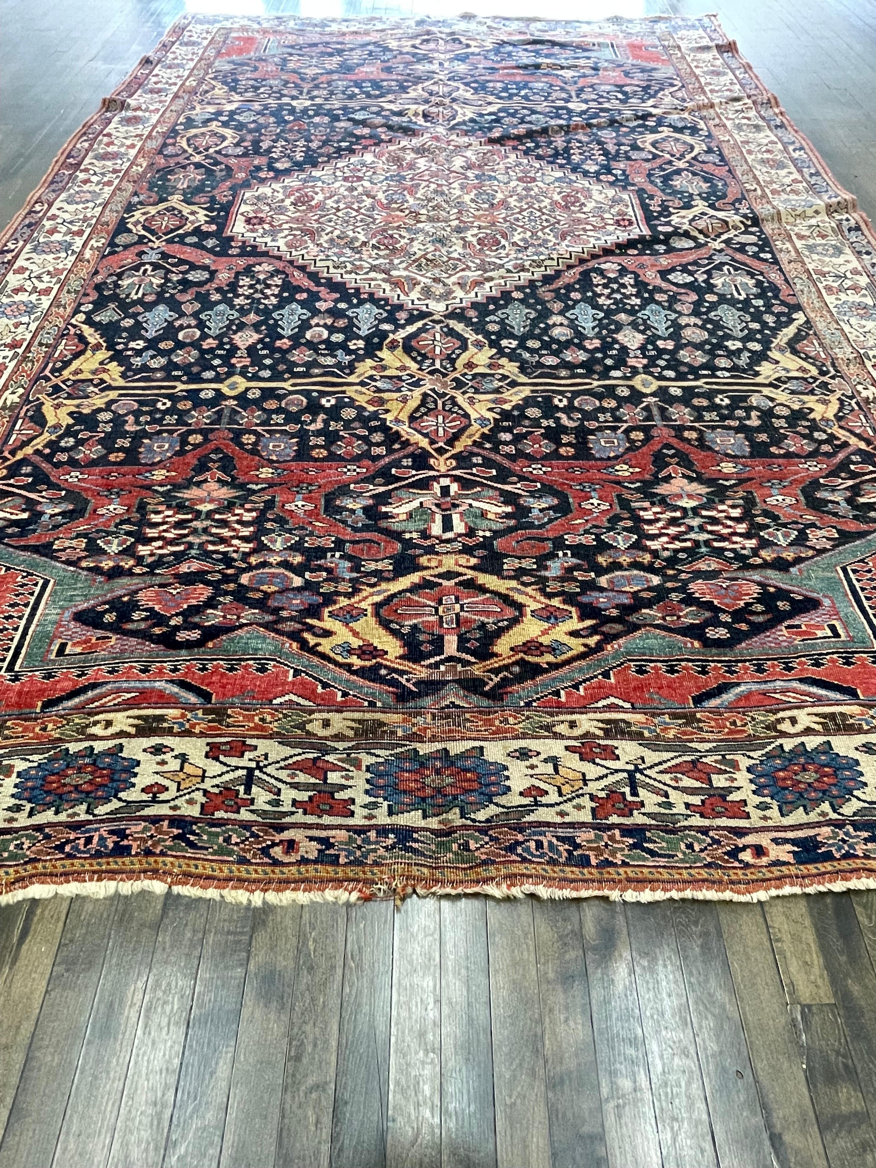 A beautiful example of much sought after Garrus design Bidjar carpet, this rug is handwoven in the town of Bijar located western Iran. Made with high quality wool both for the foundation and pile the rug has a center ivory medallion sitting on all