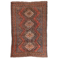 Ancien tapis géométrique tribal persan Ghashgai rouge et marine, vers 1920-1930