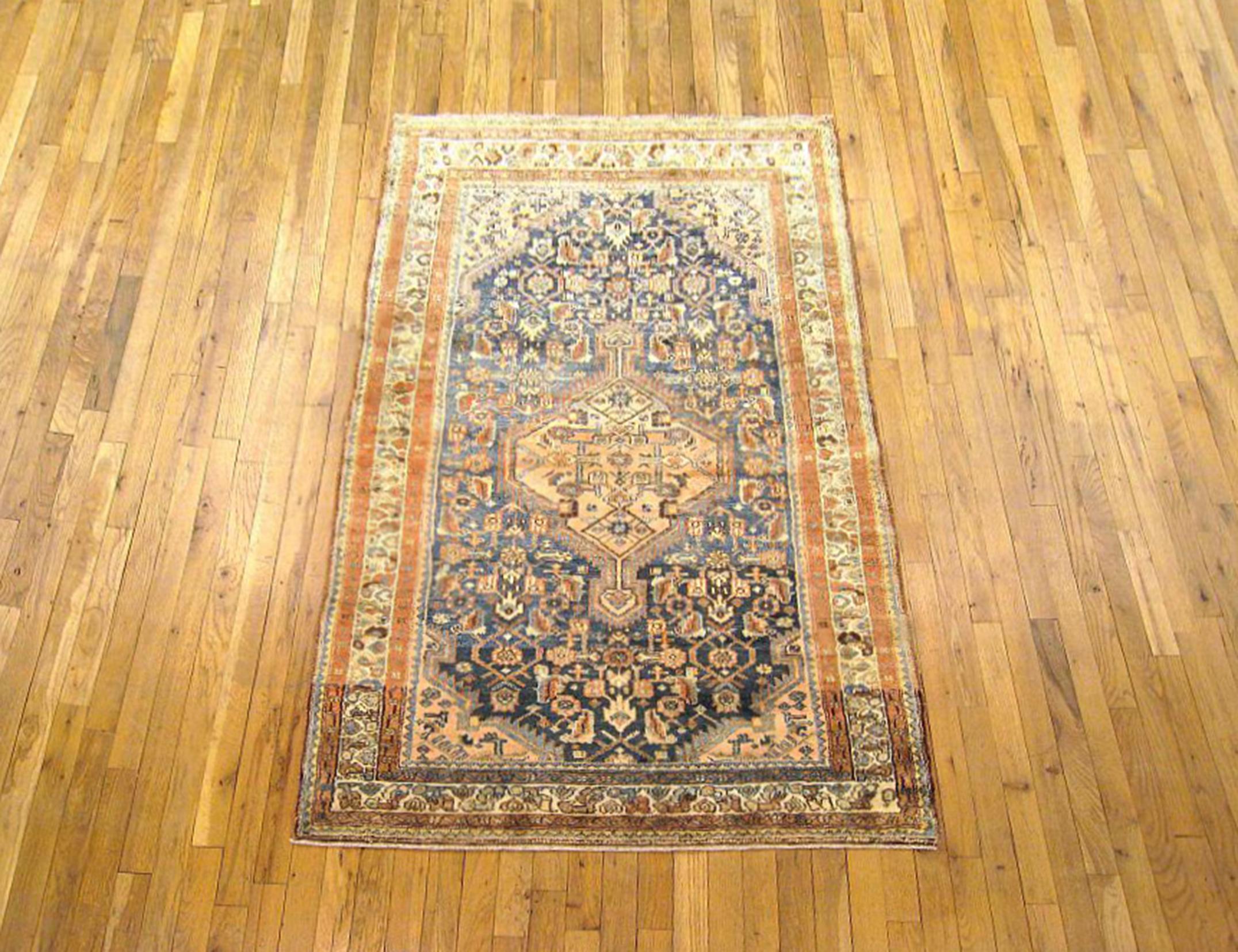 Antique Persian Hamadan Oriental rug, Small size

An antique Persian Hamadan oriental rug in small size, size 5'10”x 3'7”, circa 1920. This lovely hand-knotted carpet features a central medallion in the blue central field. The field is enclosed