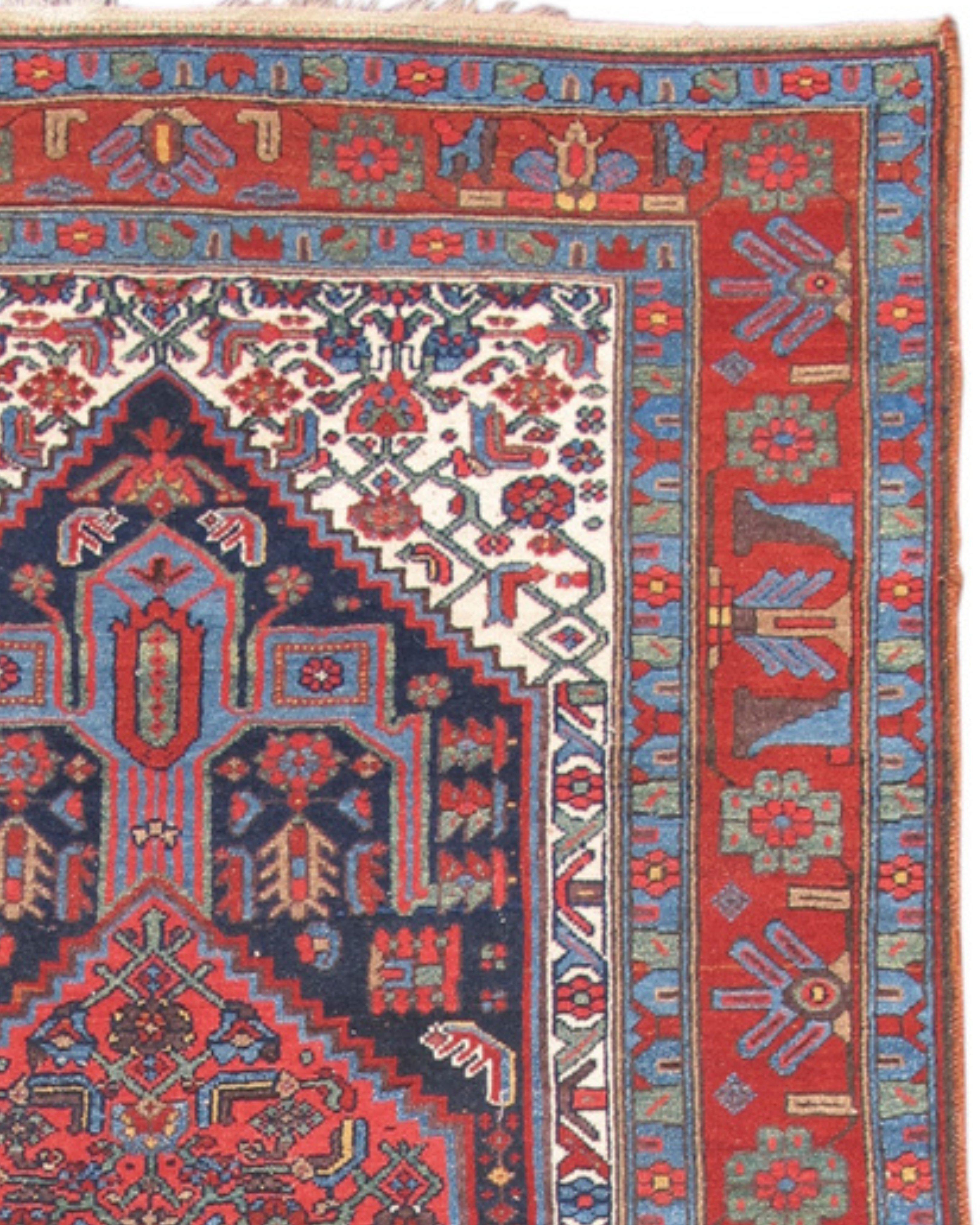 Antique Persian  Hamadan Rug, c. 1900

This happy little rug was woven in the area of the town of Hamadan in central western Persia. A traditional Persian medallion has been miniaturized and playfully reinterpreted. White corner pieces contrast