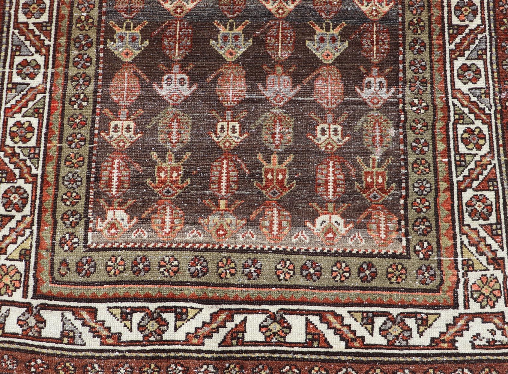 Antique Persian Hamadan rug in Wool with All-Over Sub-Geometric Tribal Design. Keivan Woven Arts; rug W22-0101, country of origin / type: Iran / Hamadan, circa 1920.
Measures: 3'7 x 7'3 
This antique Persian Hamadan rug has been hand-knotted in