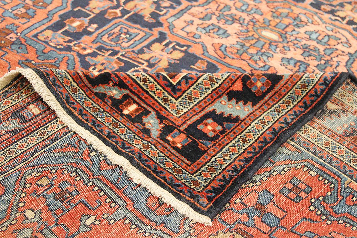 Heriz Serapi Antique Persian Hamadan Rug with Blue and Red Flower Details on Black Field For Sale