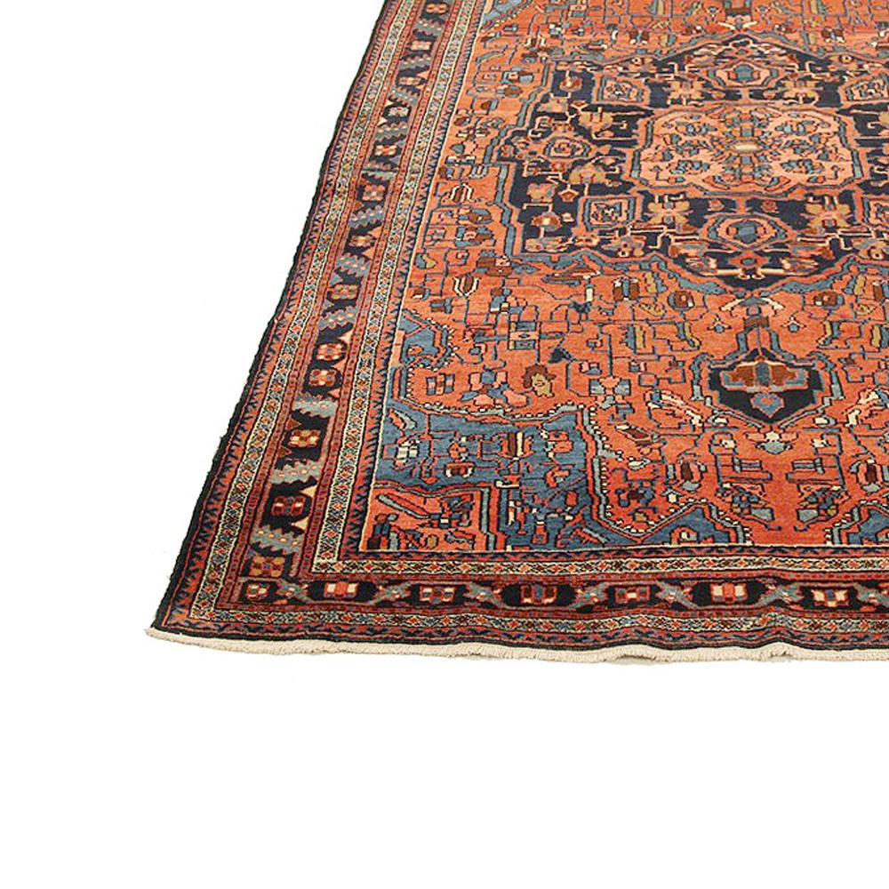 Hand-Woven Antique Persian Hamadan Rug with Blue and Red Flower Details on Black Field For Sale
