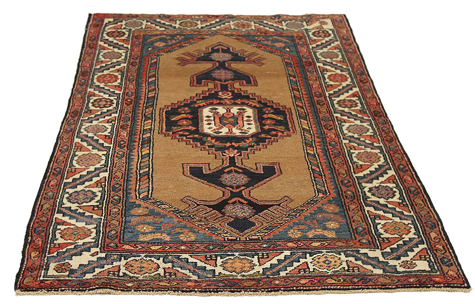 Antique Persian rug handwoven from the finest sheep’s wool and colored with all-natural vegetable dyes that are safe for humans and pets. It’s a traditional Hamedan design featuring geometric and tribal patterns in bold colors of brown and navy over