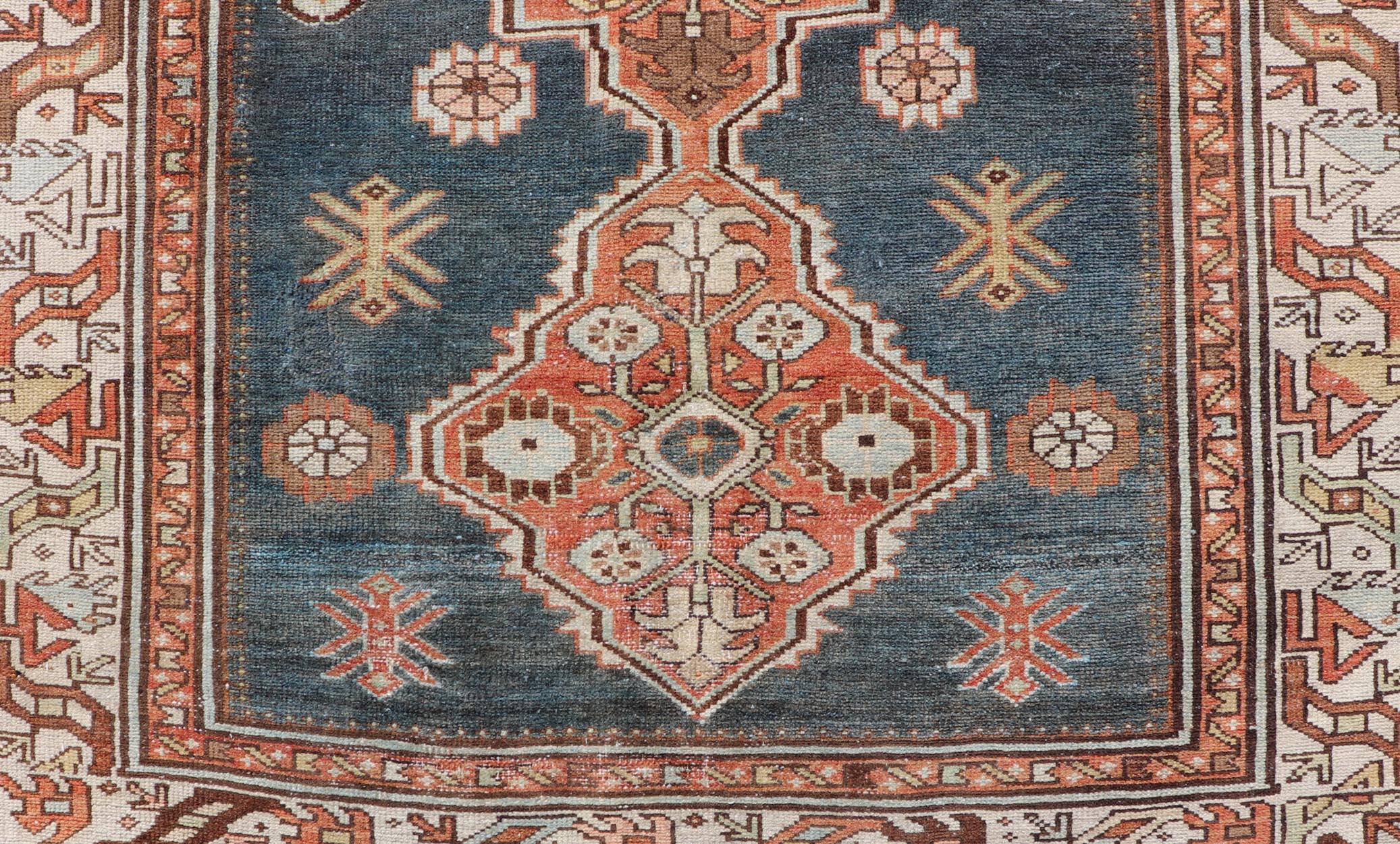 Antique Persian Hamadan Rug with Central Sub-Geometric Medallion In Blue-Gray. Keivan Woven Arts; rug EMB-22170-15064; country of origin / type: Persian / Hamadan, circa 1920.
Measures: 4'1 x 6'6
This antique Persian Hamadan rug features a layered