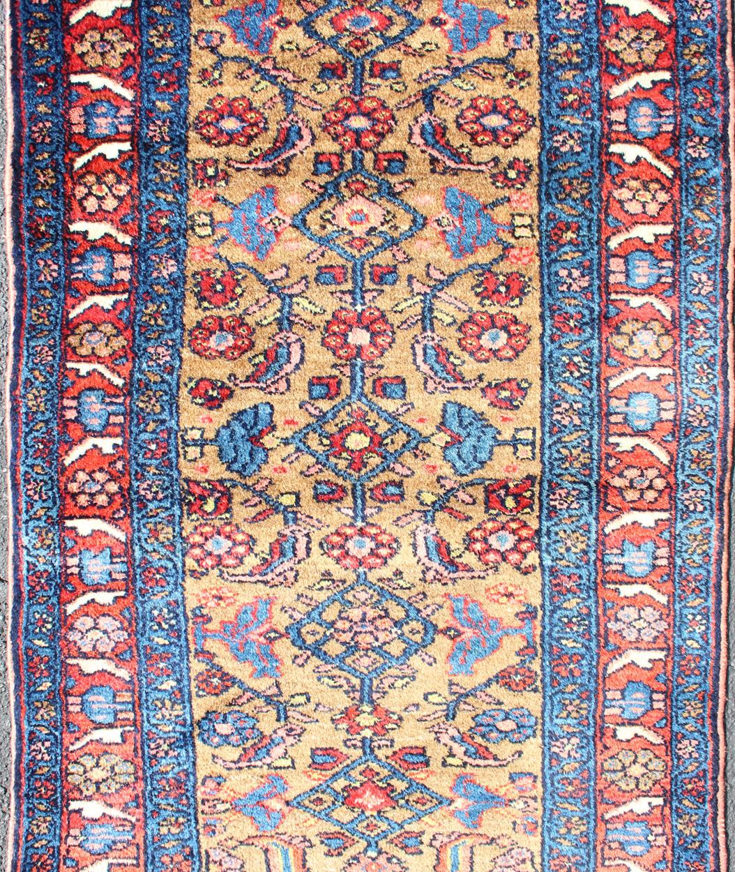 Antique Persian Hamadan rug in rich color tones and all over Herati geometric design, rug R20-0717-259 , country of origin / type: Iran / Hamadan, circa 1920.

This antique Persian Hamadan rug (circa early 20th century) features a unique blend of