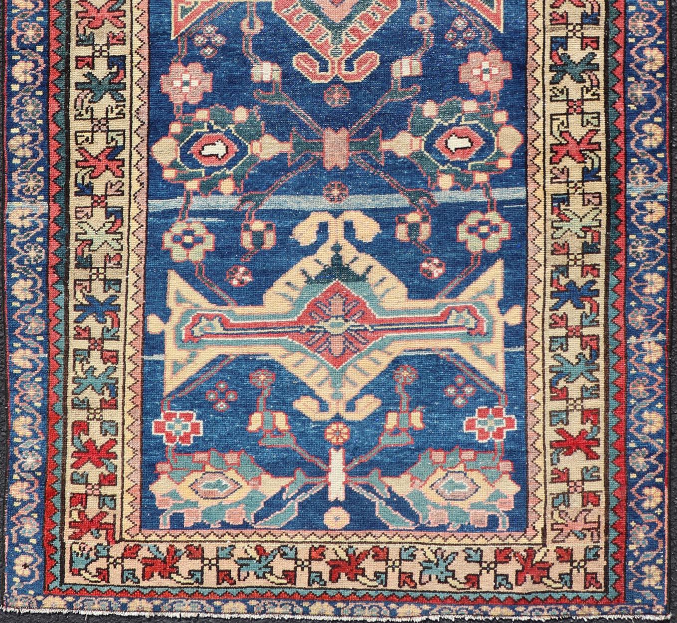 Measures: 3'4 x 6'1 
Antique Persian Hamadan Rug with Colorful Geometric Medallion on A Blue Field. Keivan Woven Arts / rug EMB-22155-15082, country of origin / type: Iran / Hamadan, circa 1920.

This antique Persian Hamadan rug (circa early 20th
