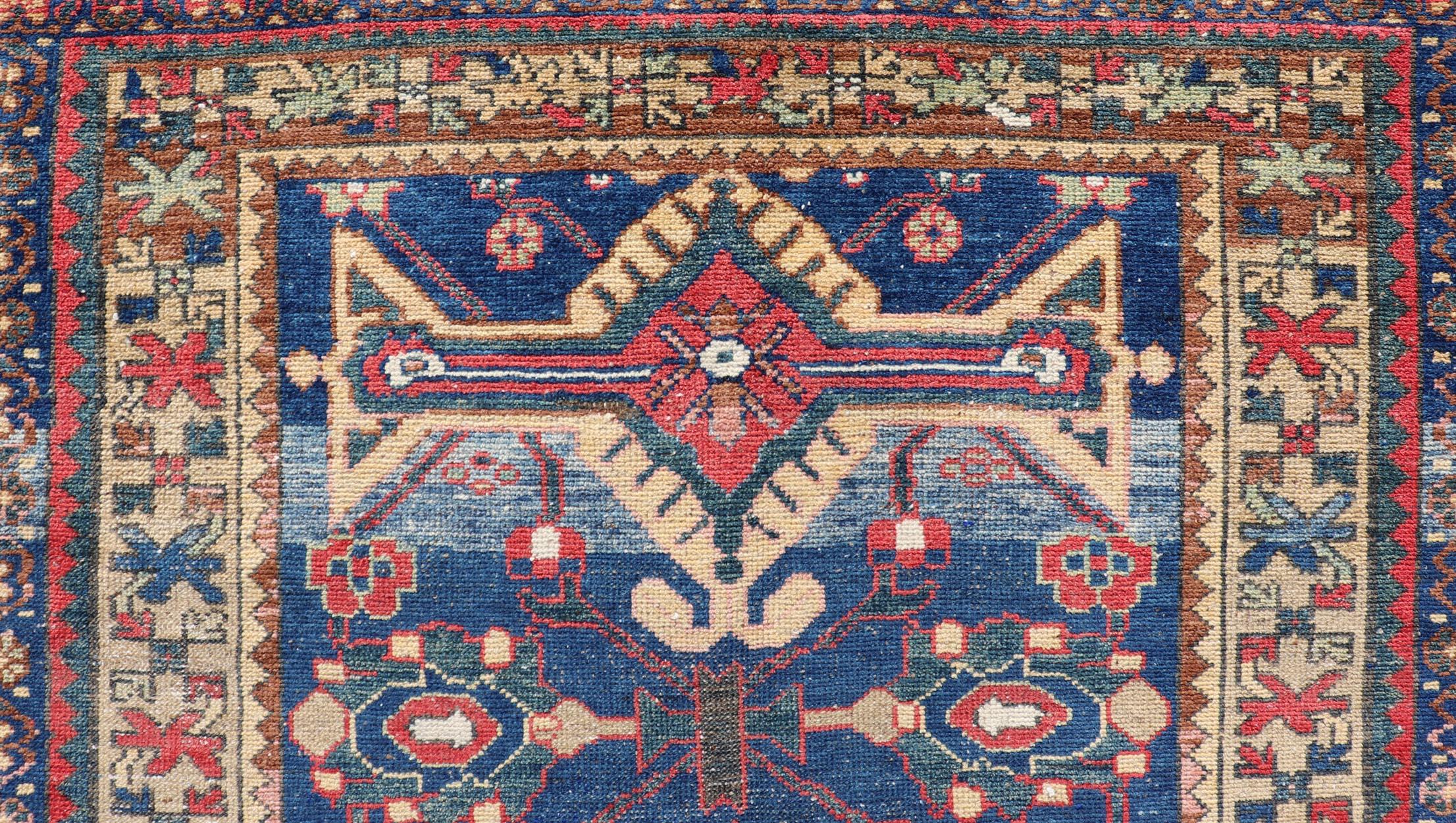 20th Century Antique Persian Hamadan Rug with Colorful Geometric Medallion on a Blue Field For Sale