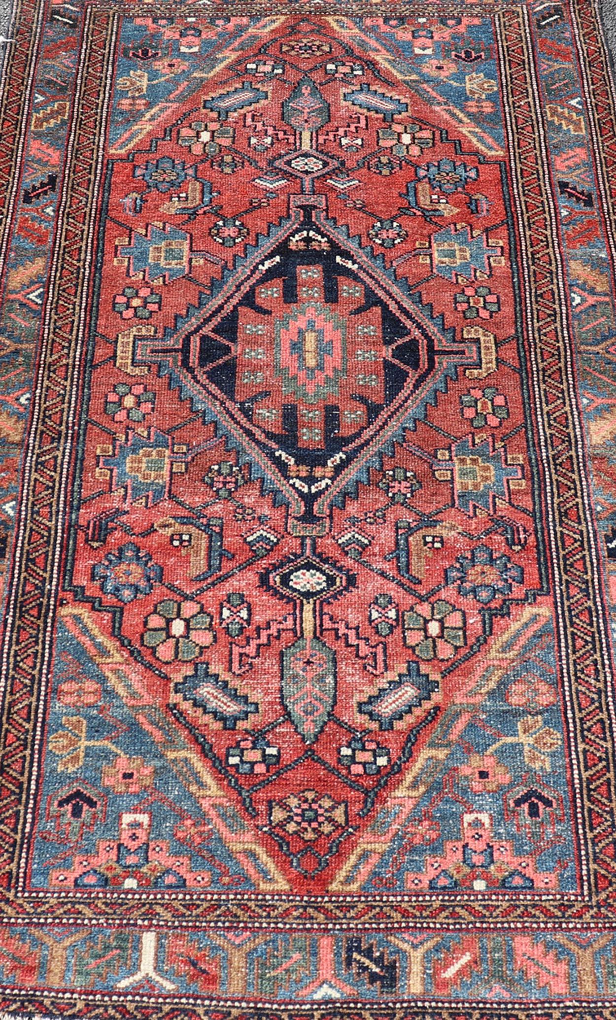 20th Century Antique Persian Hamadan Rug with Colorful Geometric Medallion on Red Background For Sale