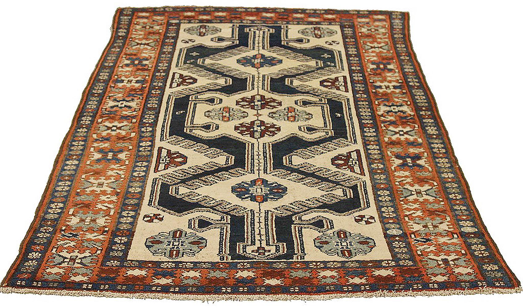 Antique Persian rug handwoven from the finest sheep’s wool and colored with all-natural vegetable dyes that are safe for humans and pets. It’s a traditional Hamedan design featuring floral patterns in gray and beige on a black field. The details are