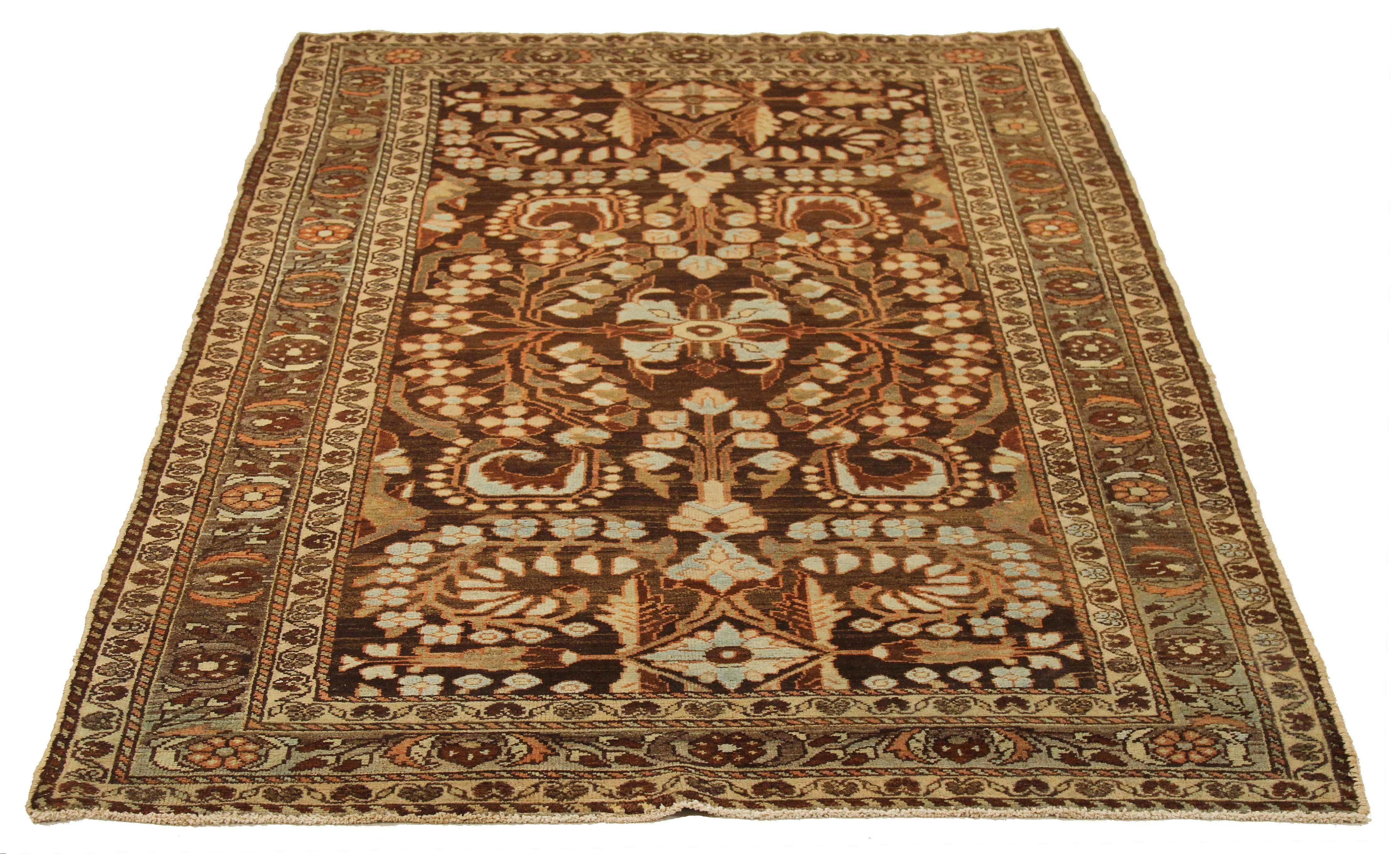 Antique Persian rug handwoven from the finest sheep’s wool and colored with all-natural vegetable dyes that are safe for humans and pets. It’s a traditional Hamedan design featuring floral patterns in green and blue over a brown field. The details