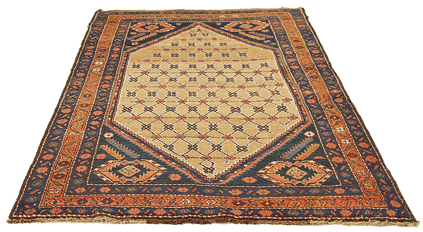 Antique Persian rug handwoven from the finest sheep’s wool and colored with all-natural vegetable dyes that are safe for humans and pets. It’s a traditional Hamedan design featuring floral patterns in pink and brown over a large beige medallion on