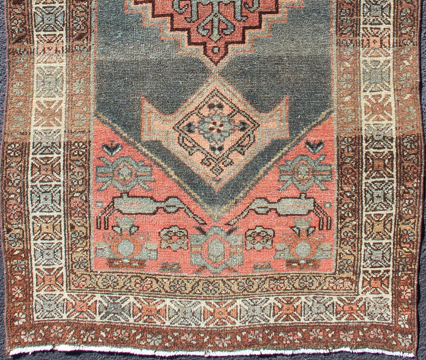 Pastel colored Persian Hamedan antique rug with large floral motifs, rug 19-0302, country of origin / type: Iran / Hamadan, circa 1920

This beautiful antique early 20th century Persian Hamadan carpet features an medallion in green and grays with
