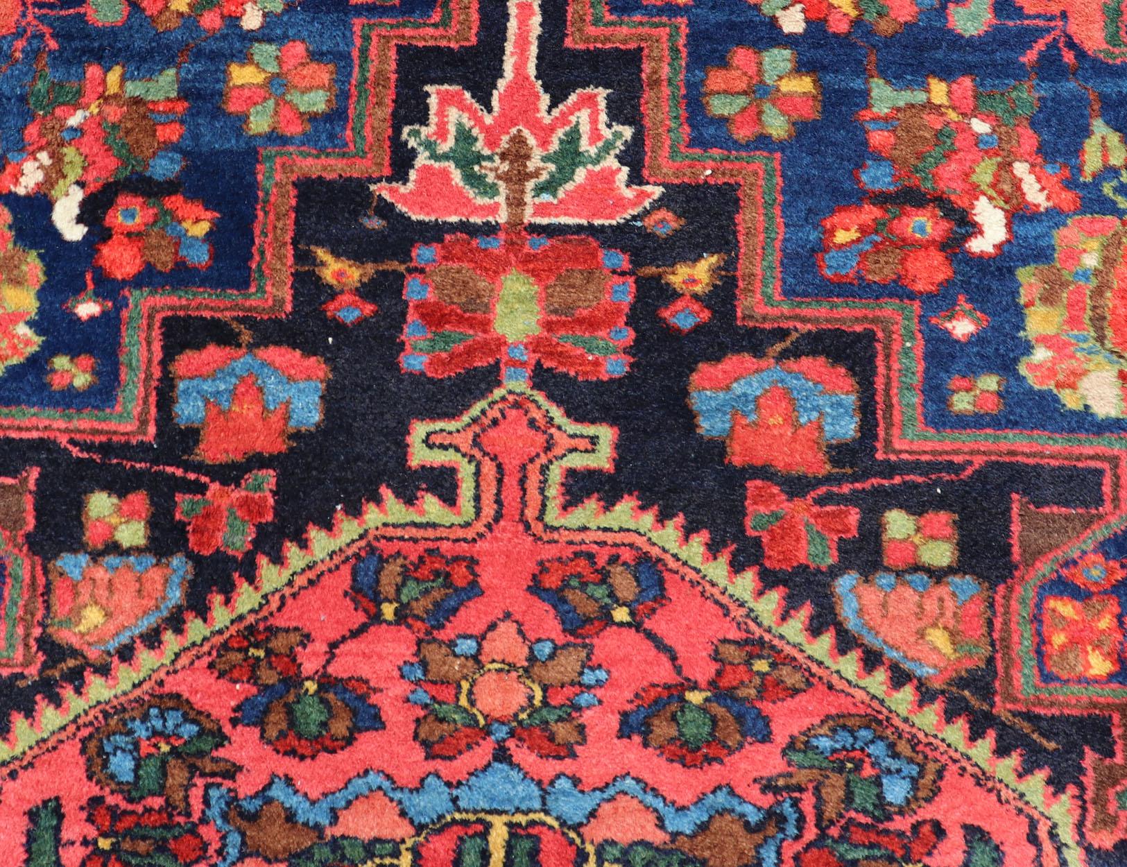 This Antique Hamadan rug hailing from Persia features a large central medallion, surrounded by sub-geometric motifs and enclosed within a complementary multi-tiered border. Keivan Woven Arts Rugs

Antique Persian Hamadan rug in rich colors with