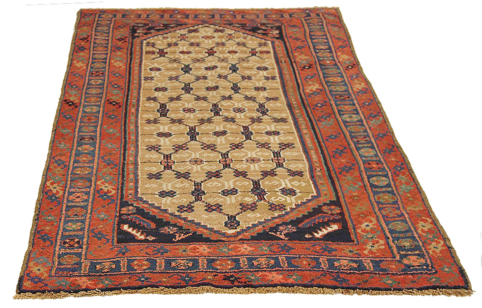 Antique Persian rug handwoven from the finest sheep’s wool and colored with all-natural vegetable dyes that are safe for humans and pets. It’s a traditional Hamedan design featuring floral patterns in bold colors of red and navy over a beige field.