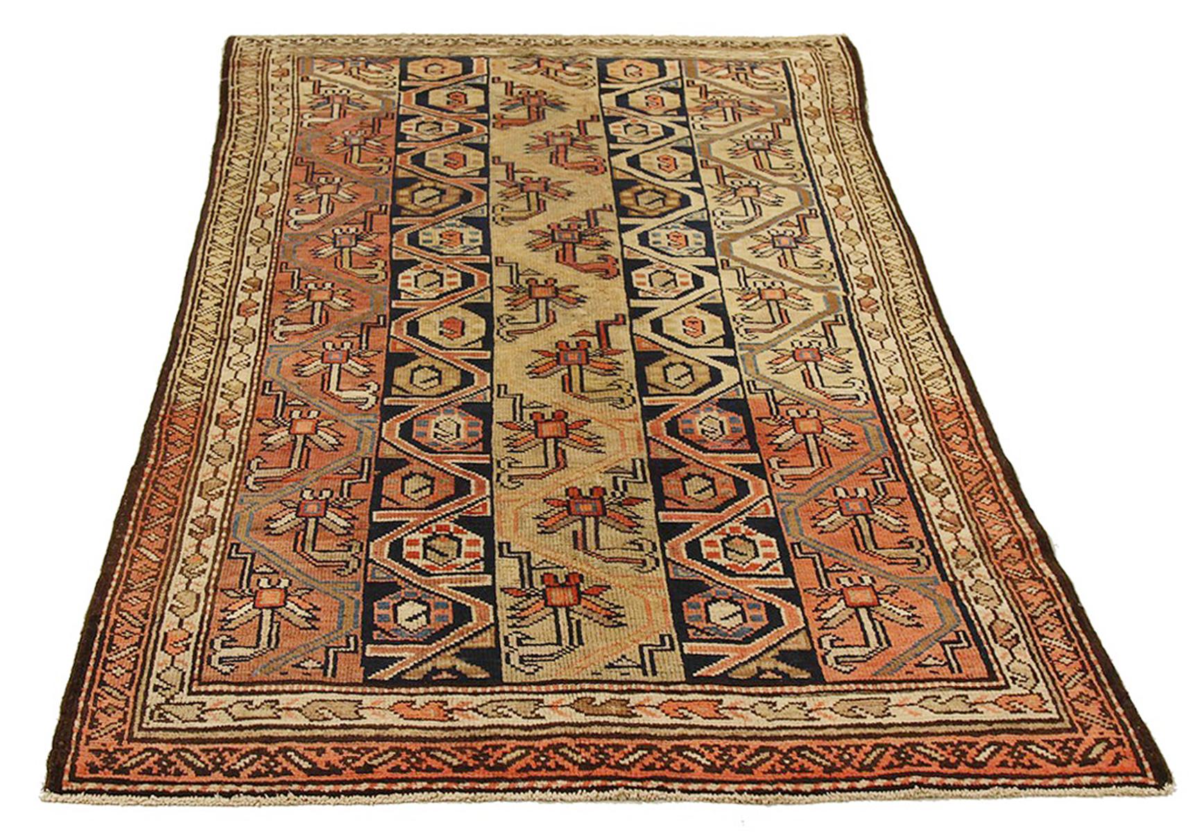 Antique Persian rug handwoven from the finest sheep’s wool and colored with all-natural vegetable dyes that are safe for humans and pets. It’s a traditional Hamedan design featuring floral patterns in bold colors of black and red over a beige and