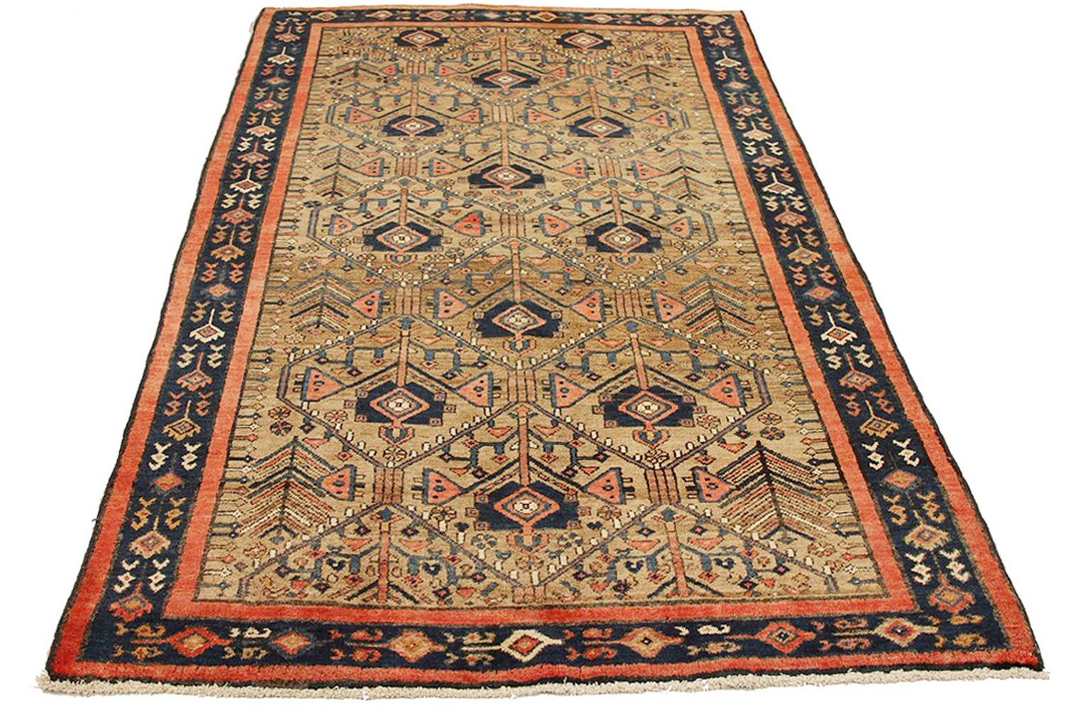 Antique Persian rug handwoven from the finest sheep’s wool and colored with all-natural vegetable dyes that are safe for humans and pets. It’s a traditional Hamedan design featuring floral patterns in lovely colors of pink and navy over a beige
