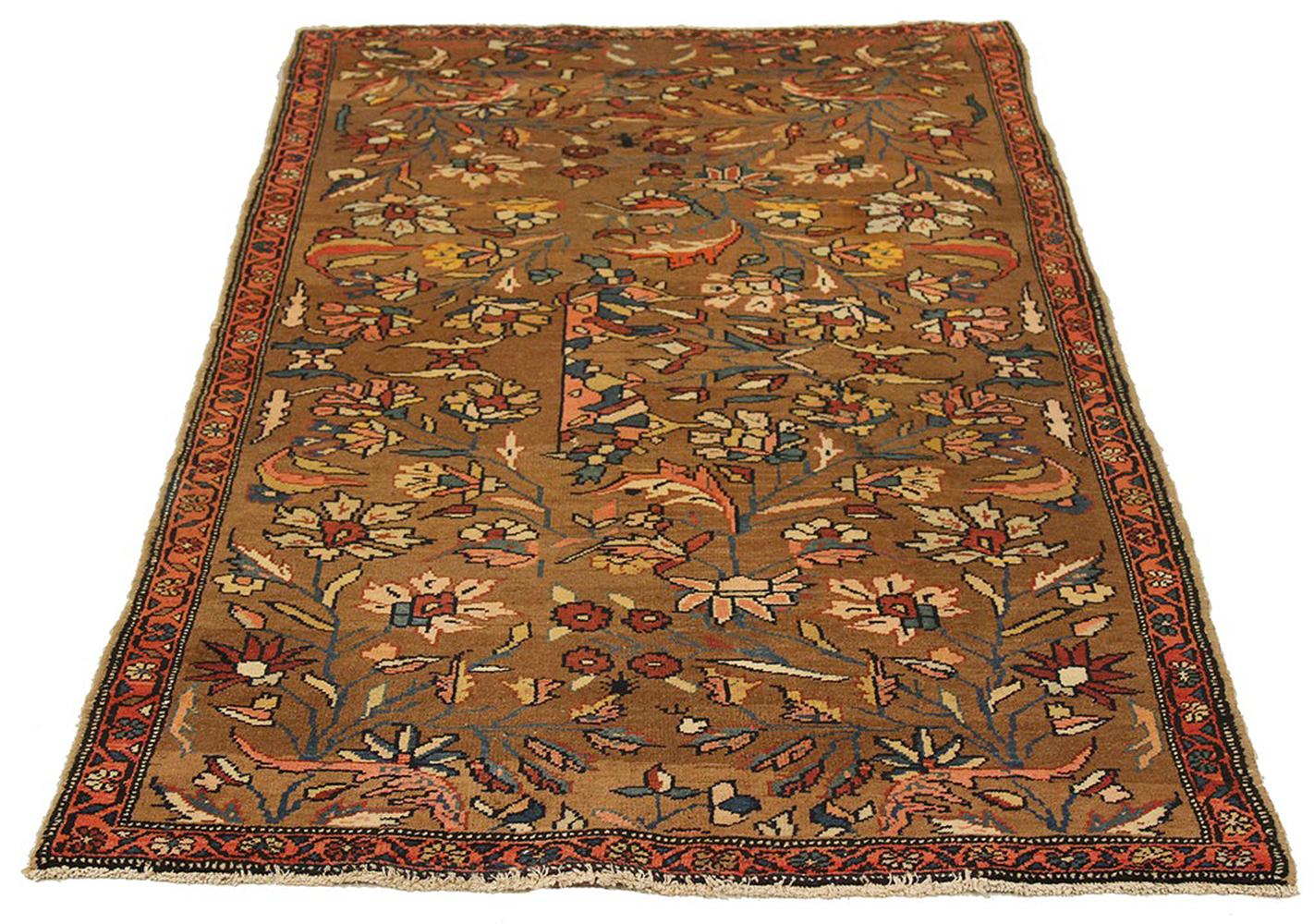 Antique Persian rug handwoven from the finest sheep’s wool and colored with all-natural vegetable dyes that are safe for humans and pets. It’s a traditional Hamedan design featuring floral patterns in pink and navy on a brown field. The details are