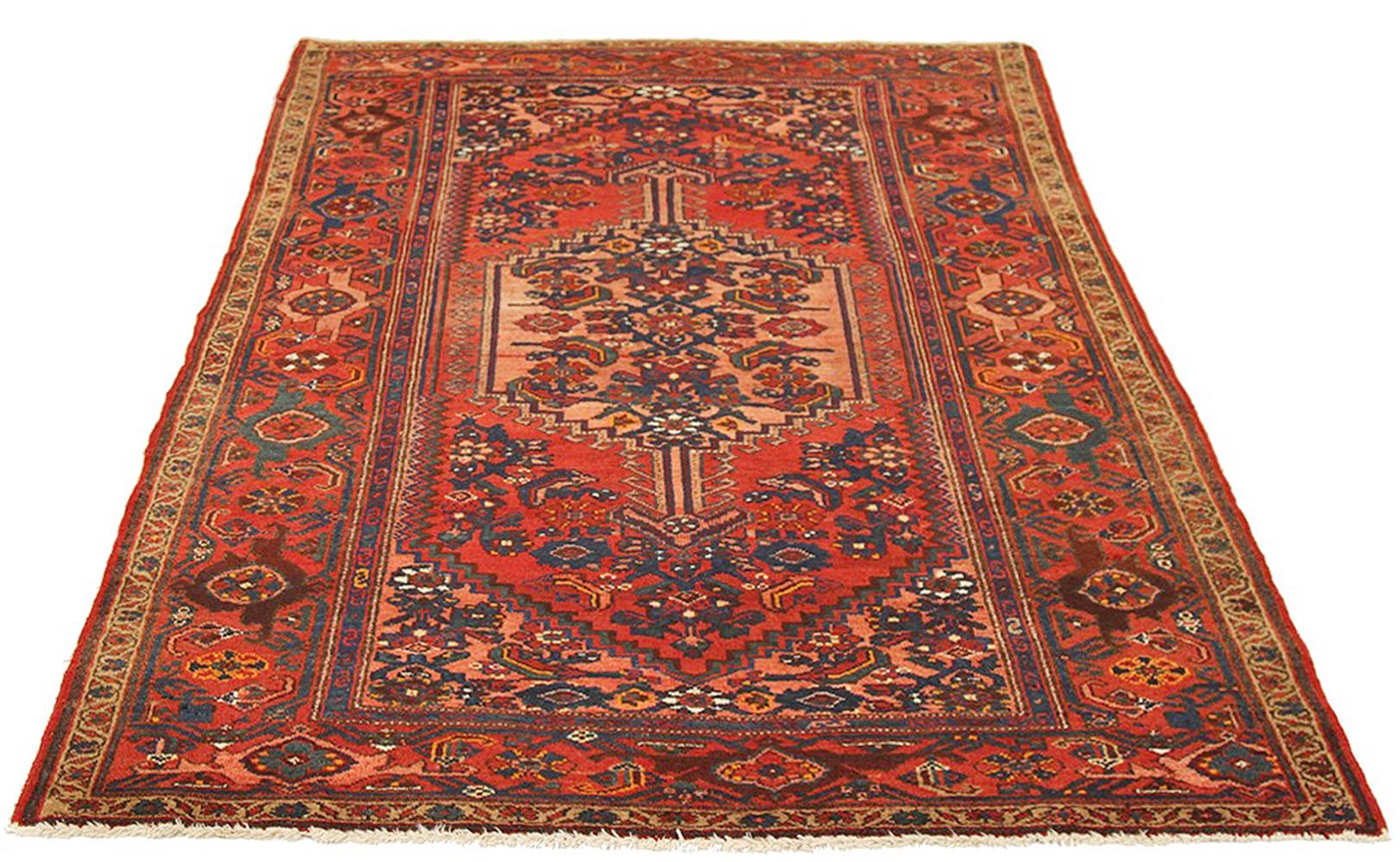 Antique Persian rug handwoven from the finest sheep’s wool and colored with all-natural vegetable dyes that are safe for humans and pets. It’s a traditional Hamedan design featuring red and navy floral details over a red and beige field. The details