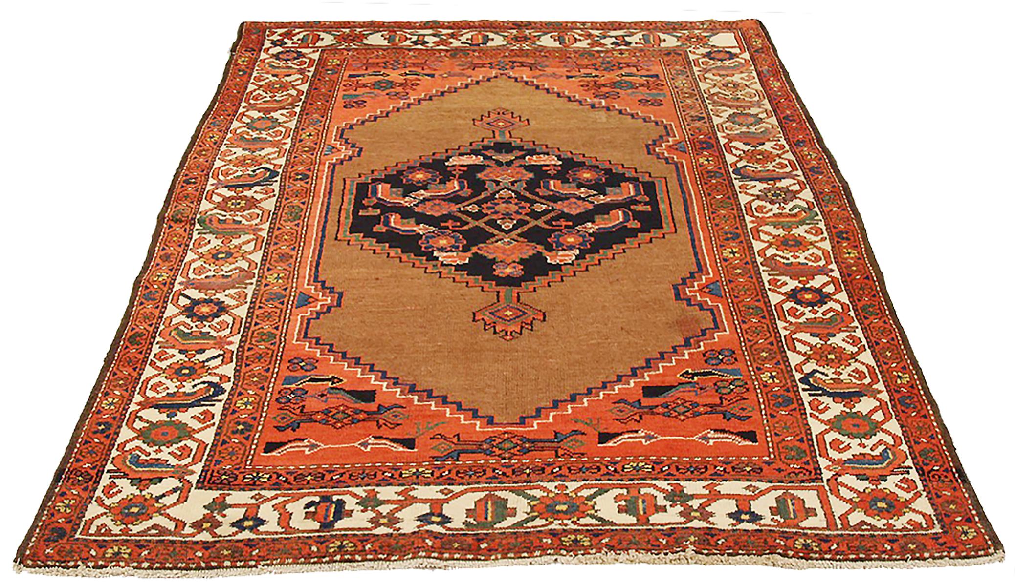 Antique Persian rug handwoven from the finest sheep’s wool and colored with all-natural vegetable dyes that are safe for humans and pets. It’s a traditional Hamedan design featuring floral patterns in bold colors of red, black, and navy over a beige