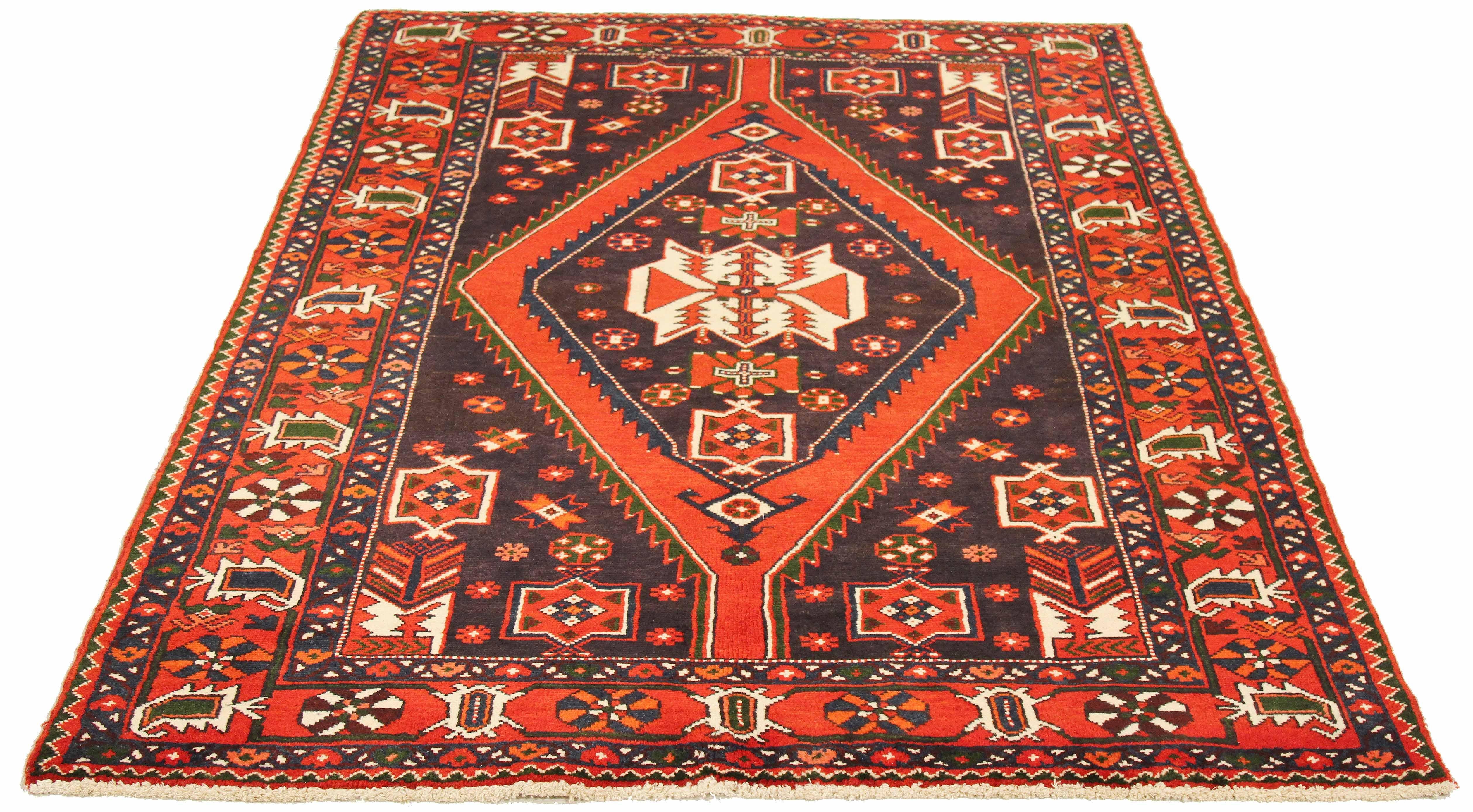 Antique Persian rug handwoven from the finest sheep’s wool and colored with all-natural vegetable dyes that are safe for humans and pets. It’s a traditional Hamedan design featuring floral and geometric patterns in red, white and blue. The details