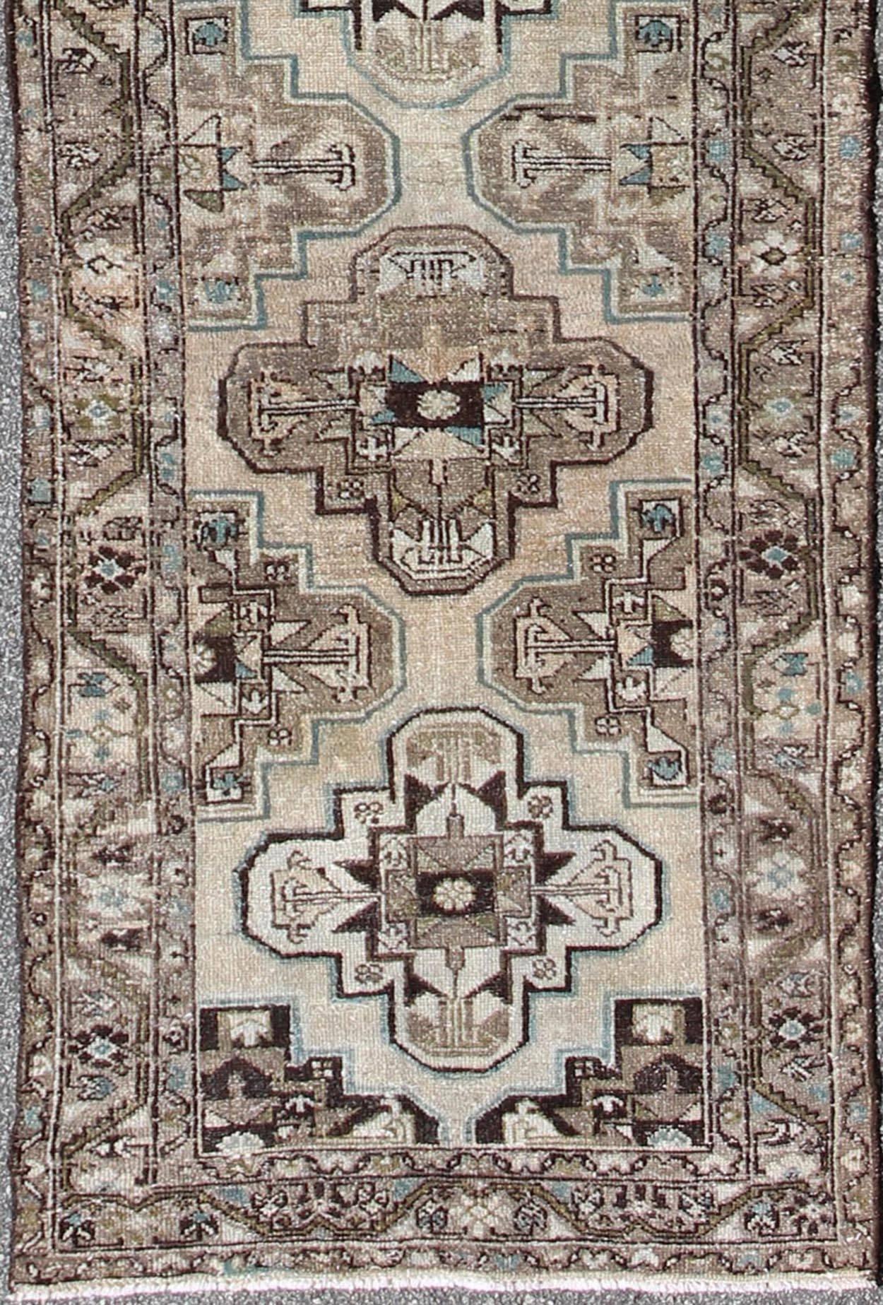Antique Persian Hamadan runner with stacked medallion in taupe, ivory, Black, Brown and blue, rug kbe-h-701-11, country of origin / type: Iran / Hamadan, circa 1900

This antique Persian Hamadan long runner from early 20th century Iran features a