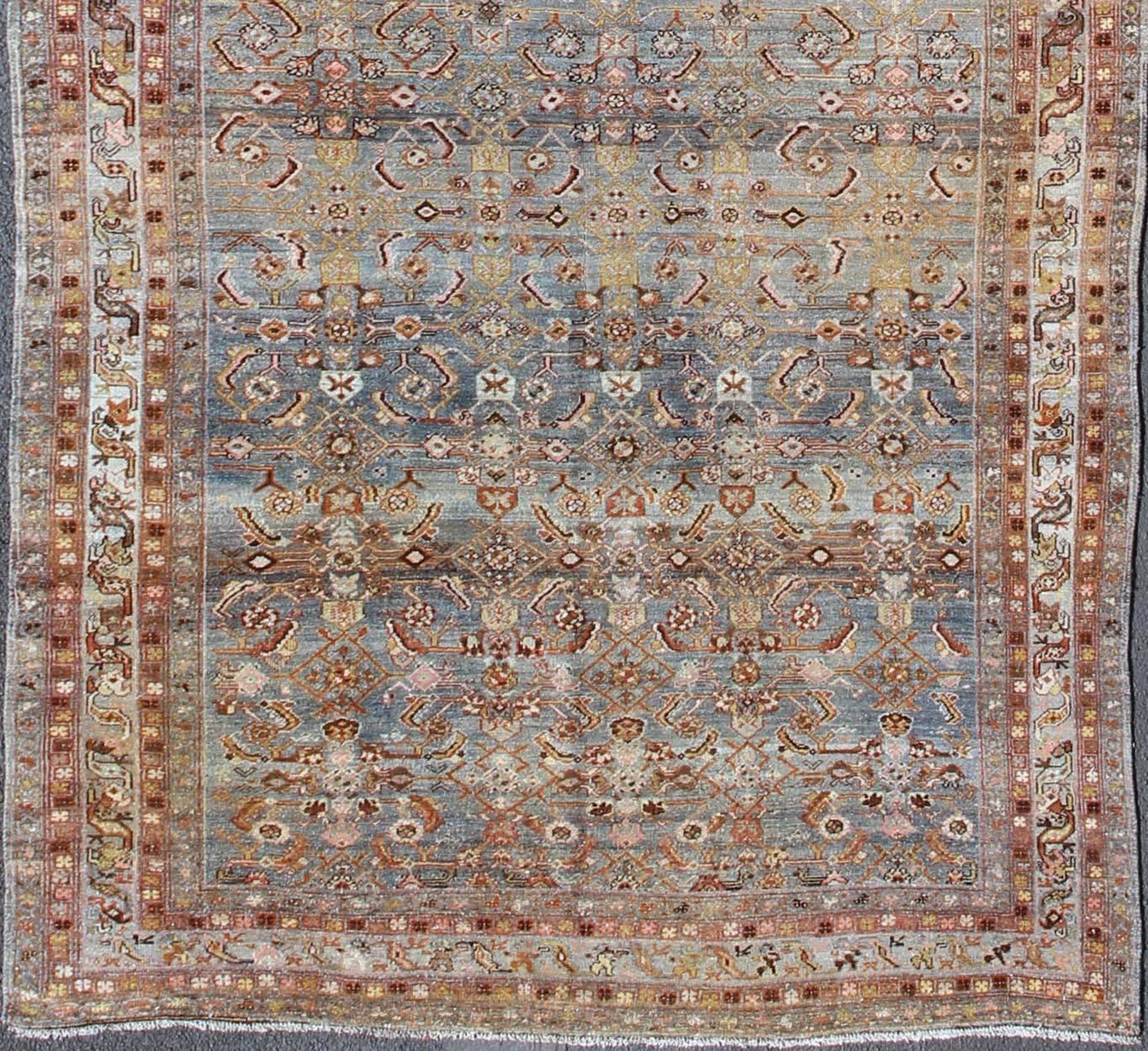 Antique Persian Hamedan with all-over Sub-Geometric Medallion Design, rug 17-1104, country of origin / type: Iran / Hamedan, circa 1910

This antique Persian Hamedan gallery rug (circa early 20th century) features a unique blend of colors and an