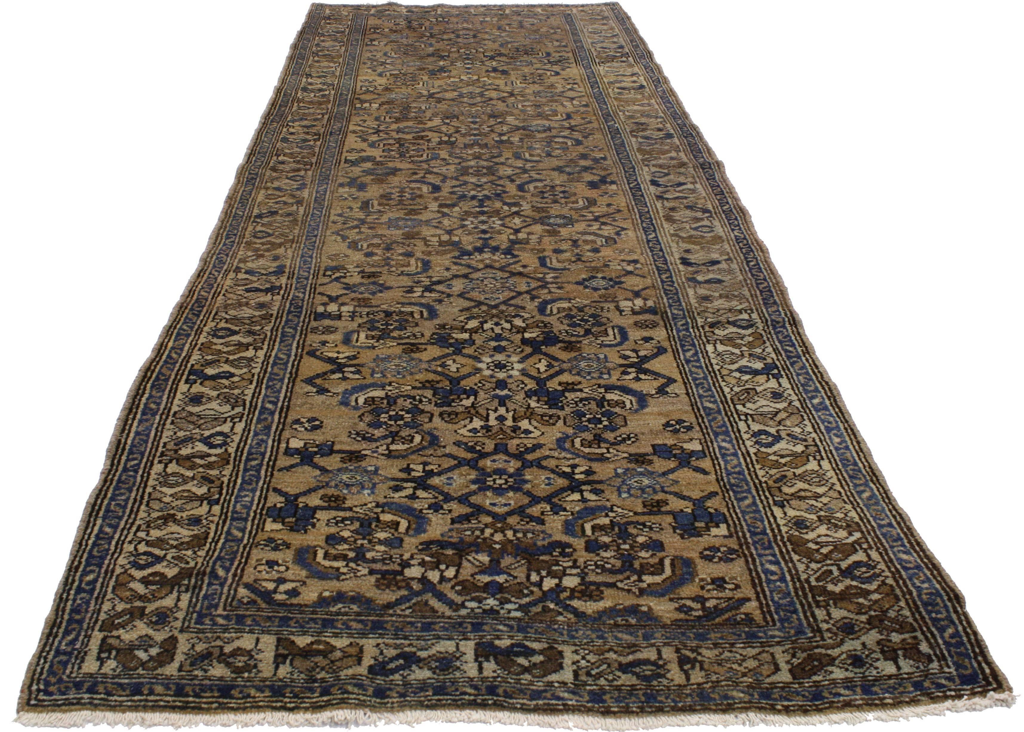 76561, antique Persian Herati Malayer runner, hallway runner. This hand-knotted wool antique Persian Malayer runner features an all-over Herati pattern on a warm, brown abrashed field. It is enclosed with a complementary beige border flanked with