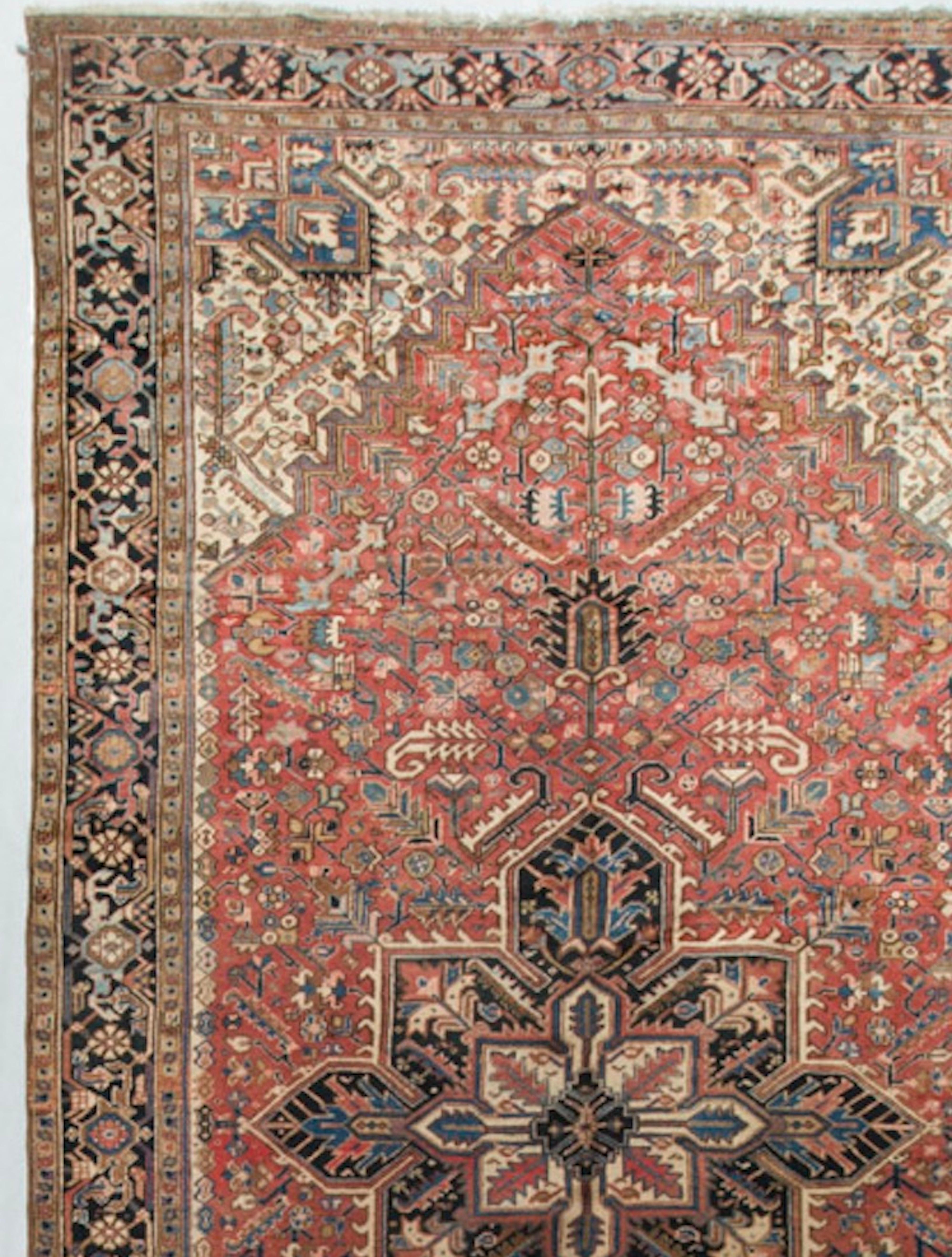 The distinctive use of the ivory in the four corners, brings the central medallion and surrounding patterns into focus and lightens up the whole field, to create this typical Heriz style rug. The small town of Heriz in North West Persia is the